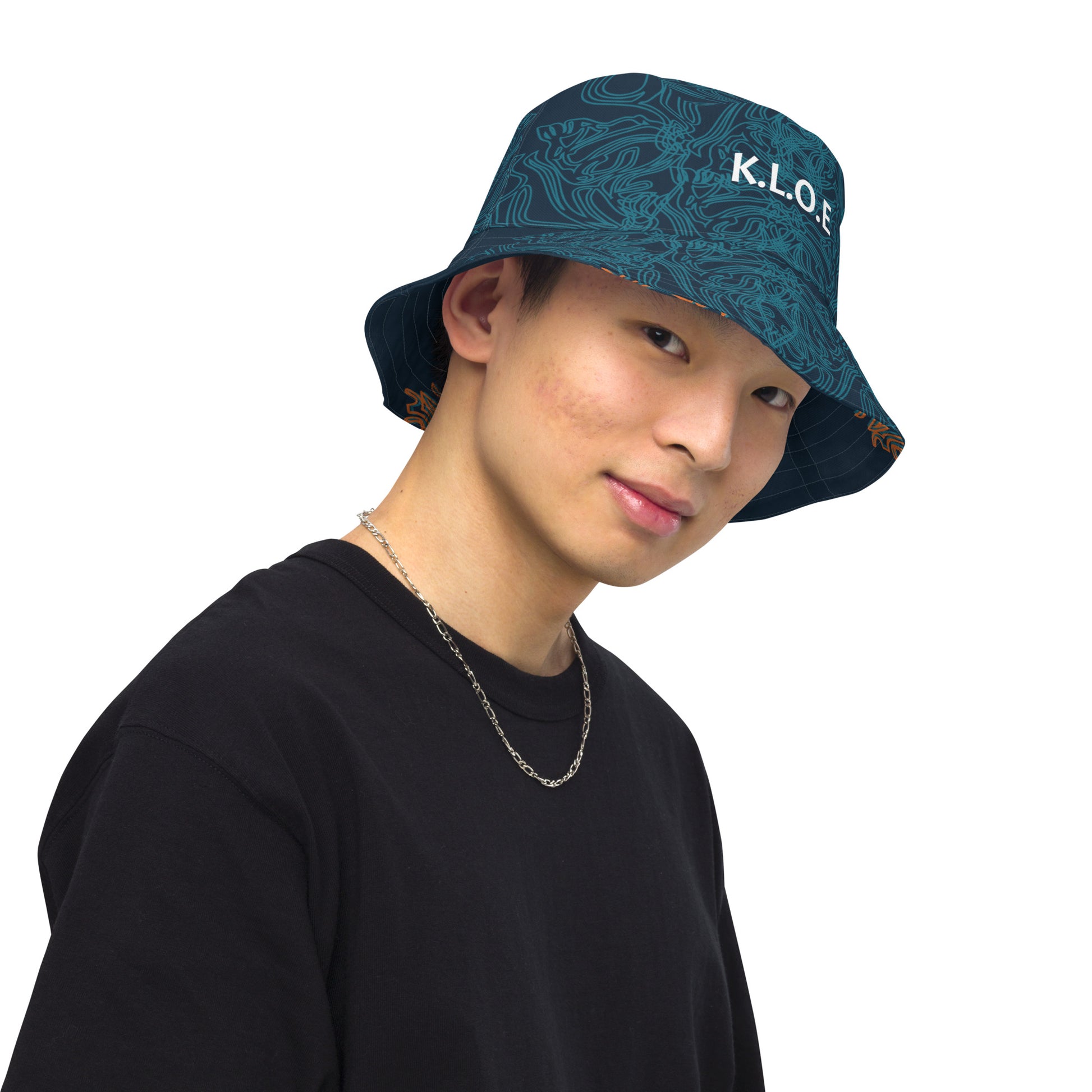 Navy blue bucket hat with cyan line art and 'K.L.O.E' branding on the front, offering a minimal yet artistic aesthetic, worn by a model.