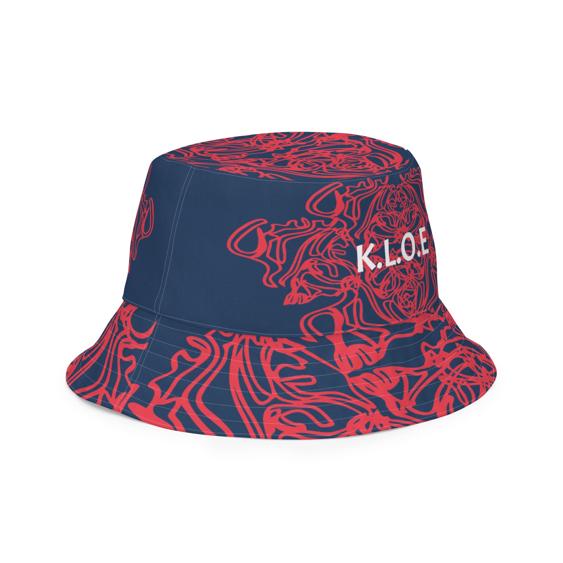 Bold reversible streetwear bucket hat featuring hand-drawn tribal patterns on one side and a mirrored face design on the other, crafted in navy and red for an edgy, modern look – KLOE fashion.