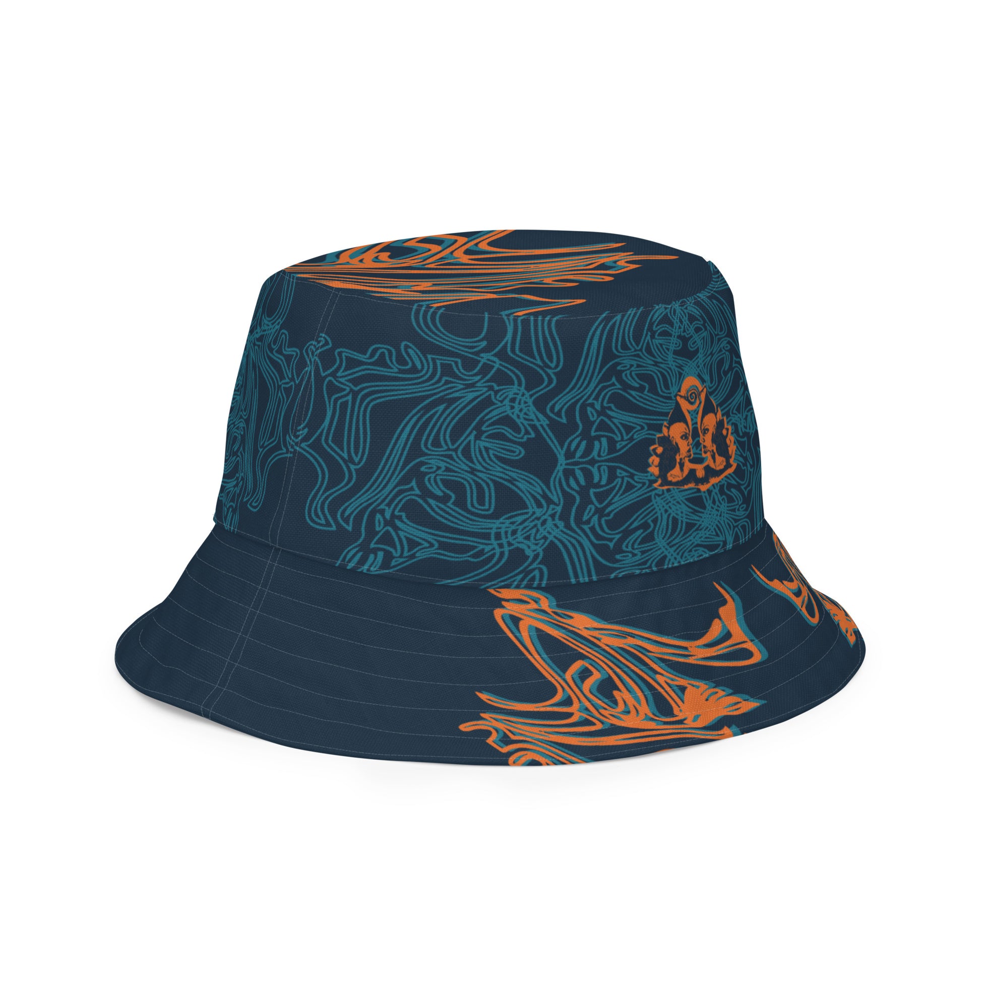 Reversible bucket hat featuring a small orange mirrored face motif and bold tribal-inspired patterns, blending art and streetwear.