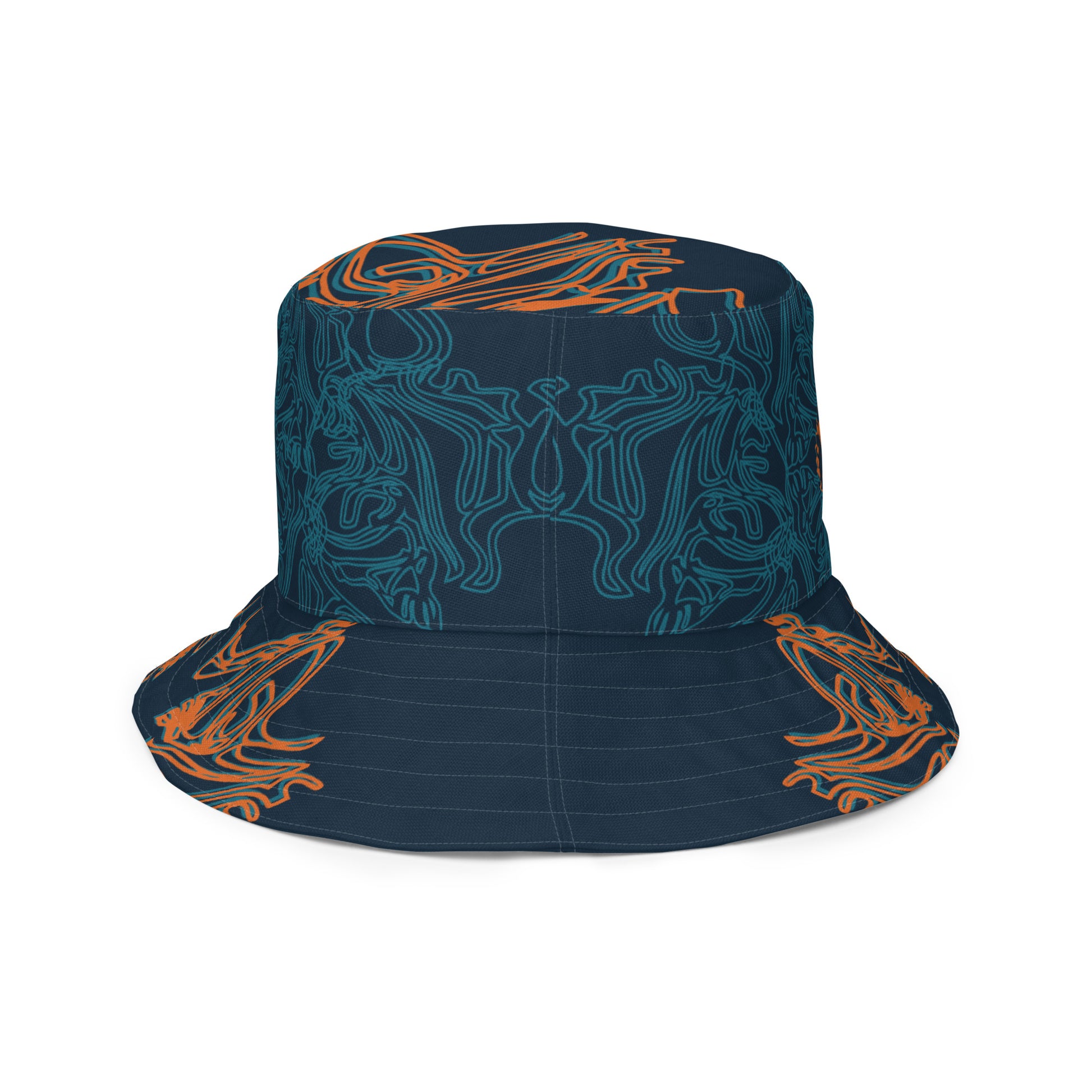 Reversible bucket hat featuring a small orange mirrored face motif and bold tribal-inspired patterns, blending art and streetwear.