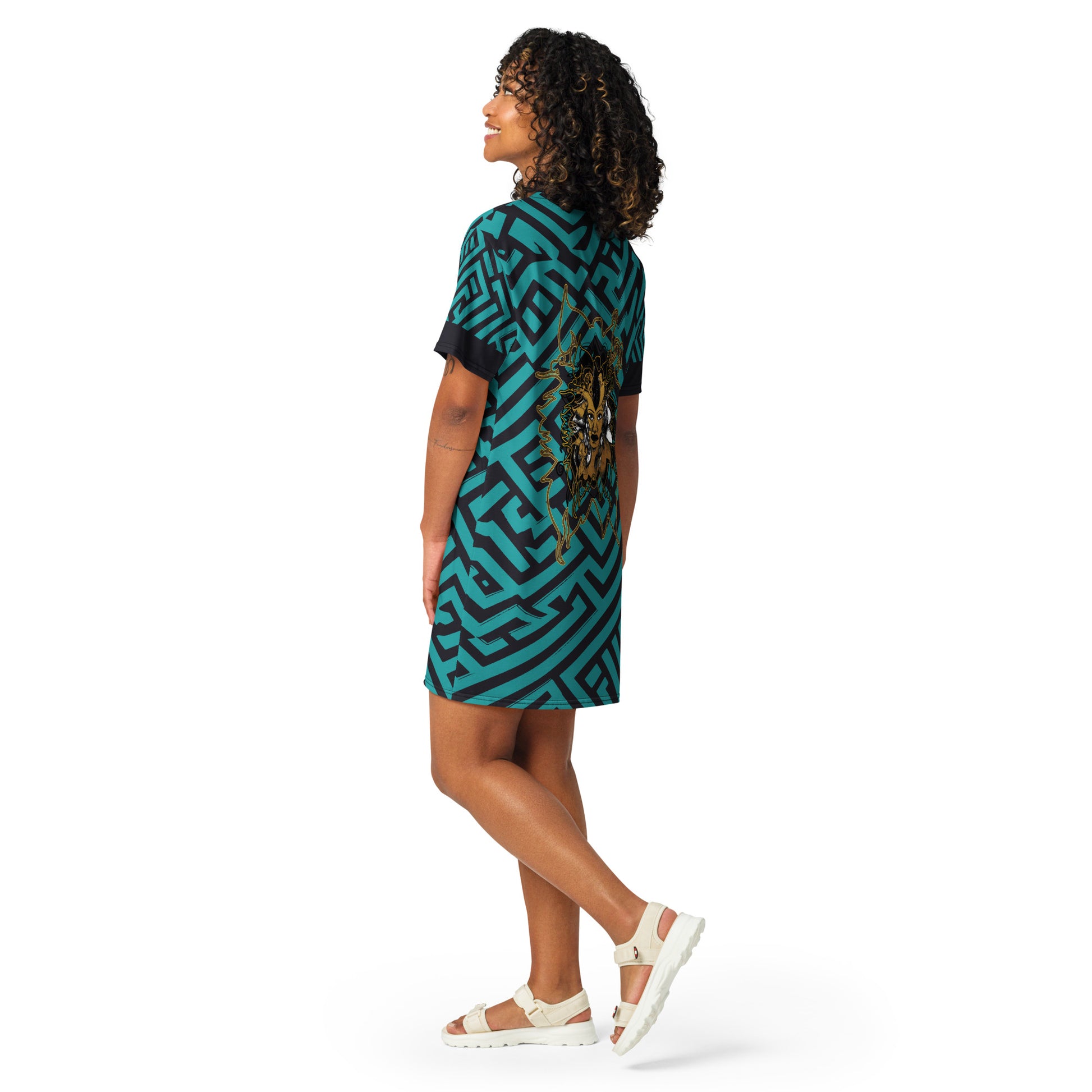 Back view of KLOE Store bohemian style dress featuring bold green and black geometric patterns with an intricate golden artistic face design, highlighting expressive and modern boho fashion, on a model.