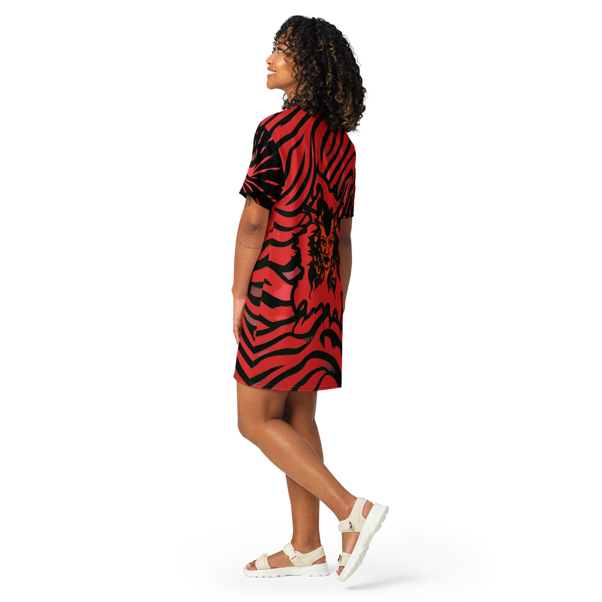 Model wearing a bold red and black t-shirt dress from Kloe Store with an artistic face design, showcasing a stylish and edgy streetwear look with striking patterns and a modern, casual fit.