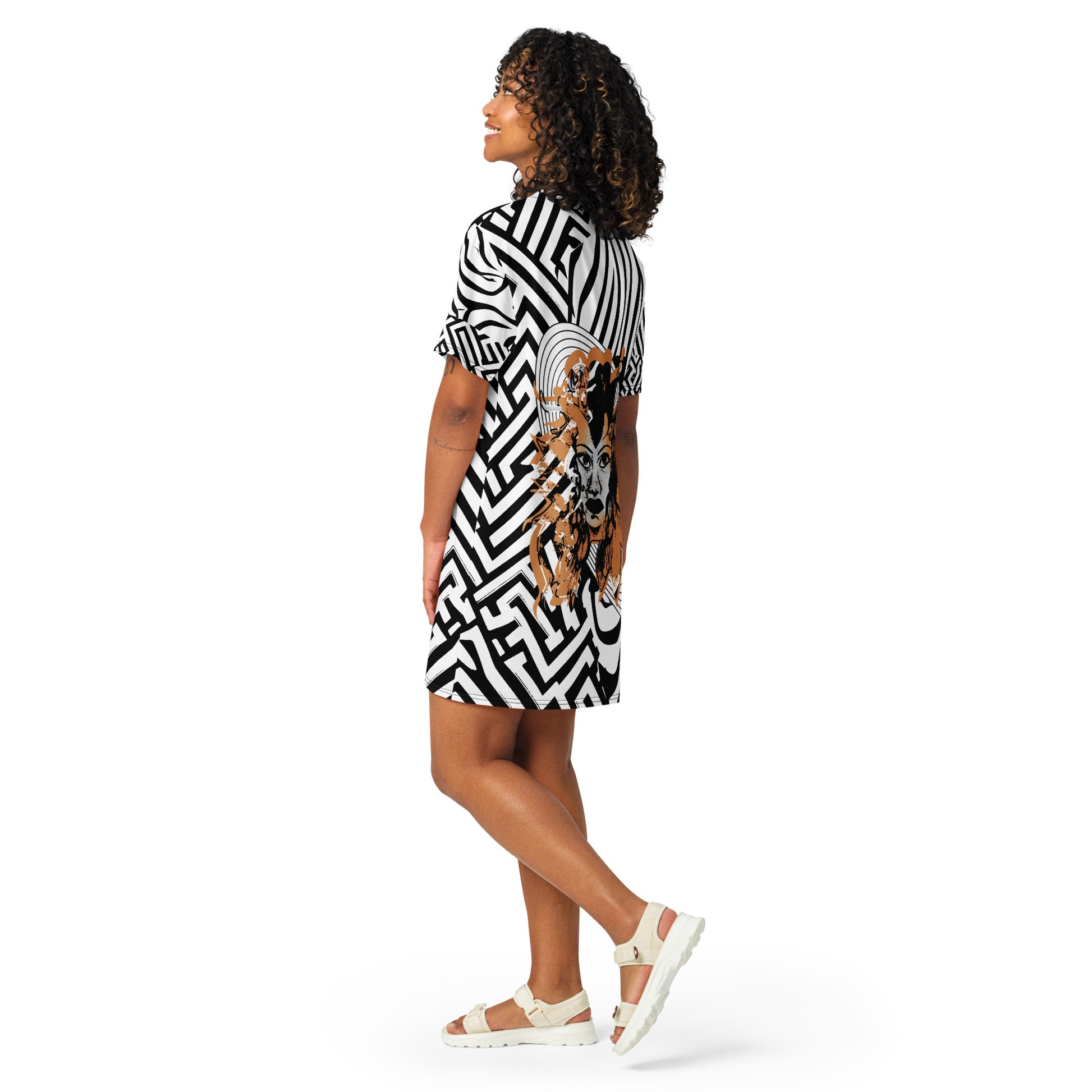 Model wearing bold black and white zebra print t-shirt dress from Kloe Store featuring an artistic face design in the center, showcasing unique streetwear style with abstract patterns and edgy fashion.