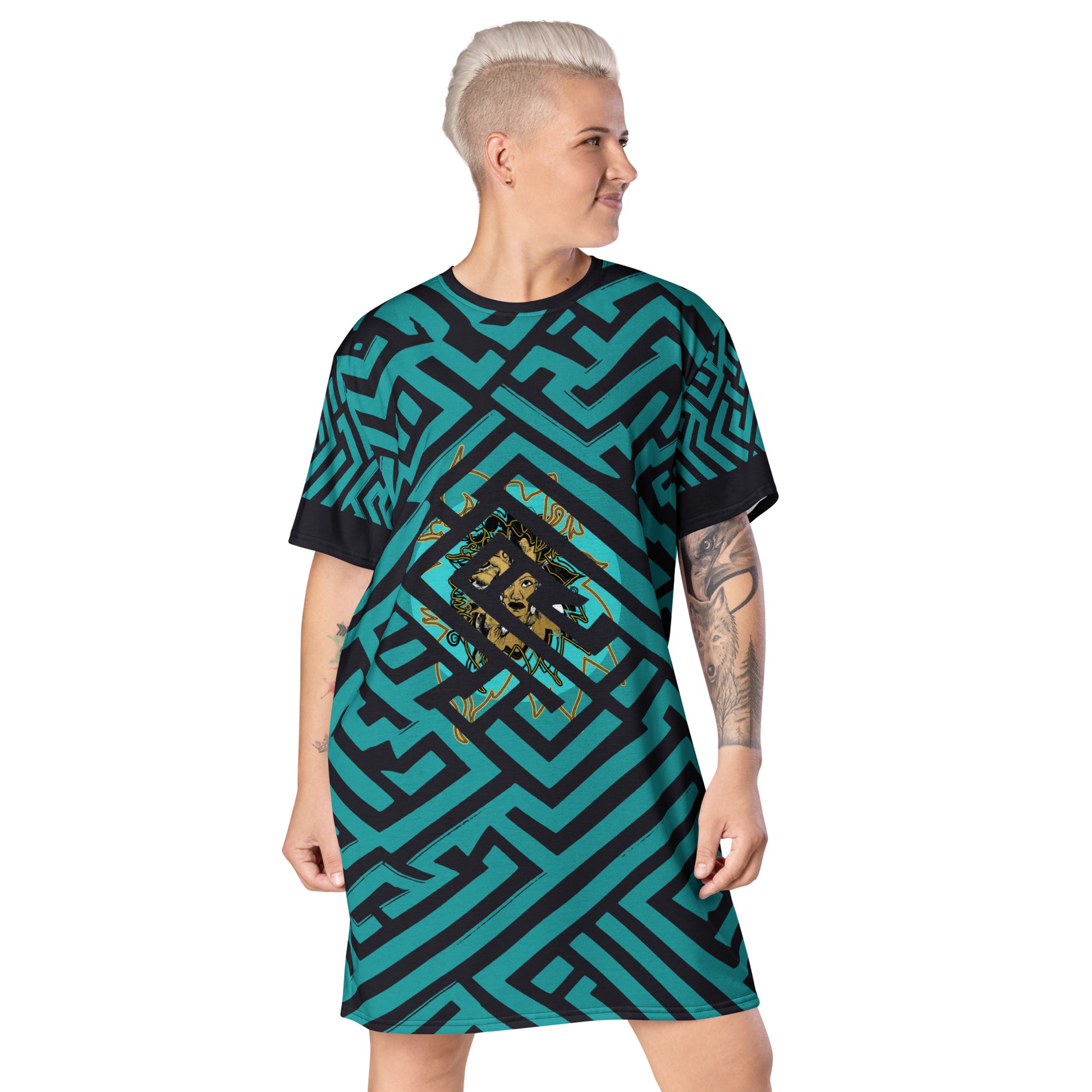 A model wearing KLOE bohemian style dress featuring bold green and black geometric patterns with a central golden artistic face design, showcasing expressive and modern boho style fashion.
