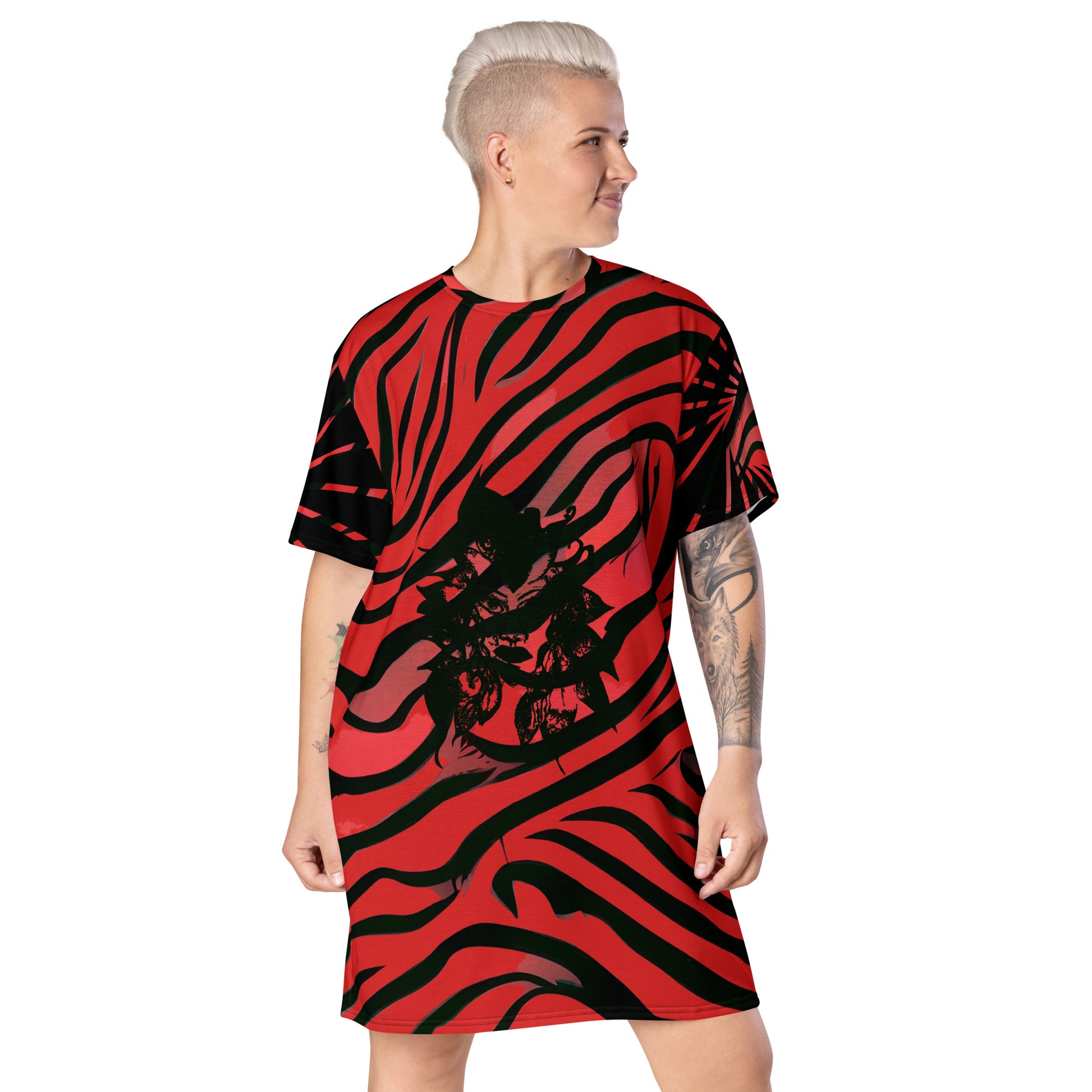 Model wearing a bold red and black t-shirt dress from Kloe Store with an artistic face design, showcasing a stylish and edgy streetwear look with striking patterns and a modern, casual fit.