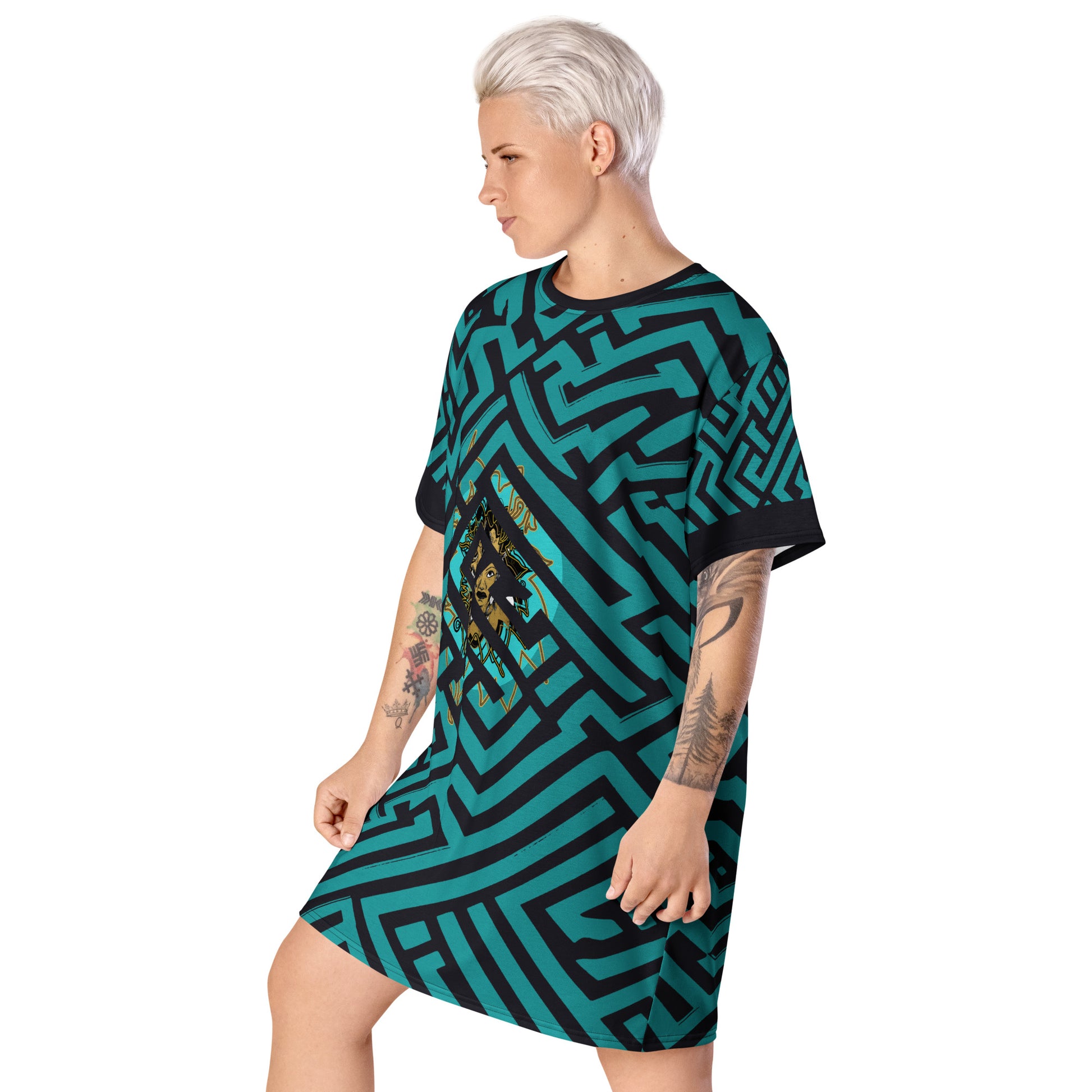 Side view of a model wearing KLOE bohemian style dress featuring bold green and black geometric patterns with a central golden artistic face design, showcasing expressive and modern boho style fashion.