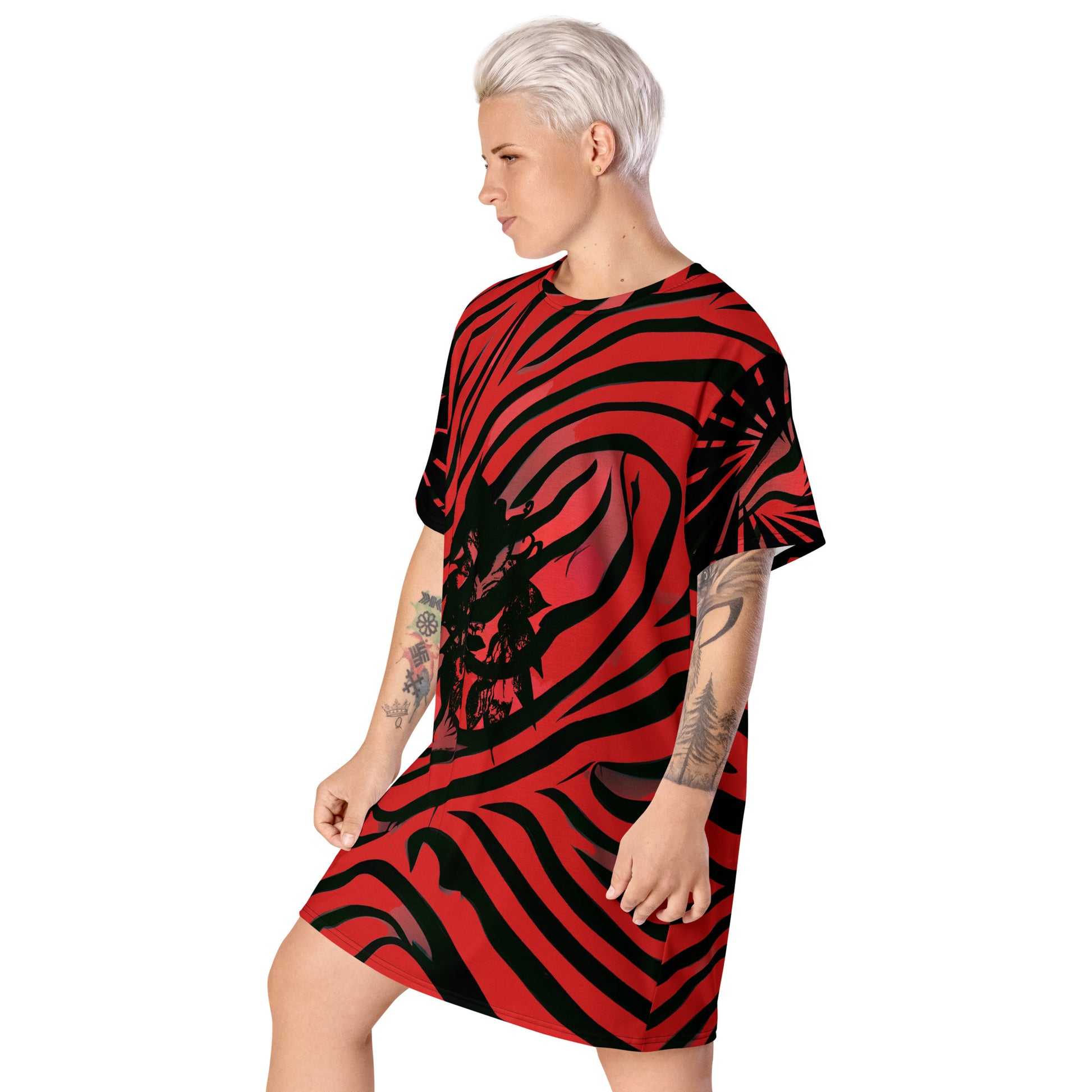 Model wearing a bold red and black t-shirt dress from Kloe Store with an artistic face design, showcasing a stylish and edgy streetwear look with striking patterns and a modern, casual fit.