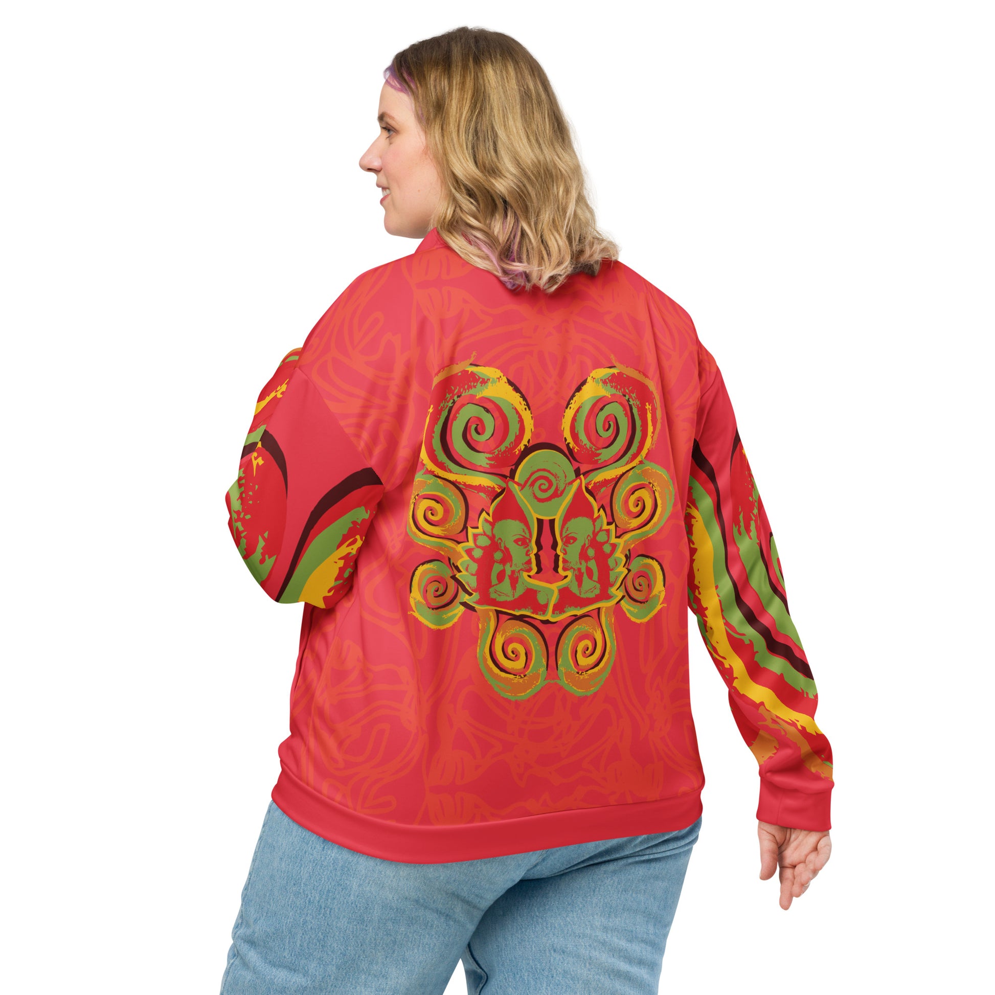 Red bomber jacket with vibrant swirl sleeve details and mirrored face design on the back, inspired by cultural art and bold self-expression.