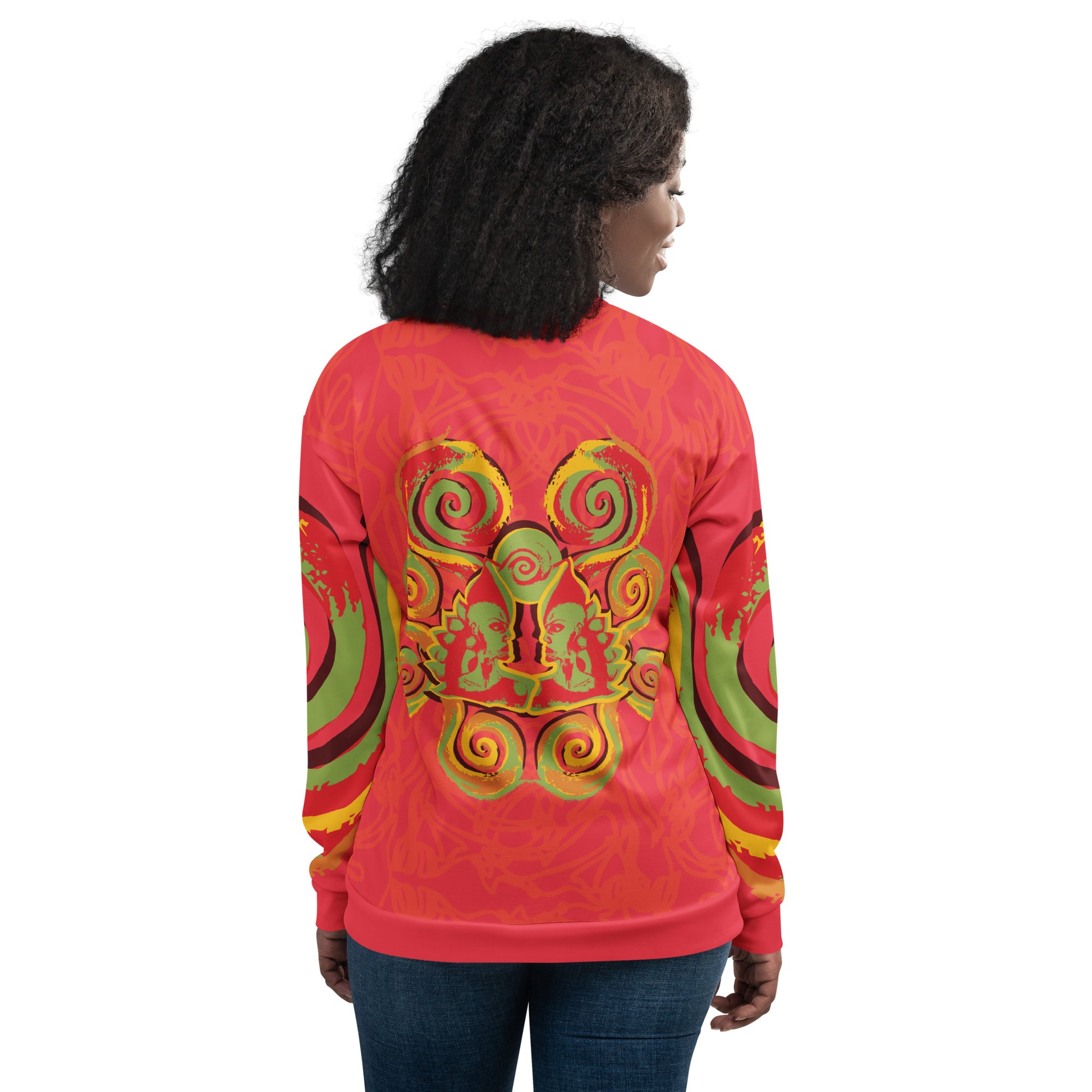 Red bomber jacket with vibrant swirl sleeve details and mirrored face design on the back, inspired by cultural art and bold self-expression.