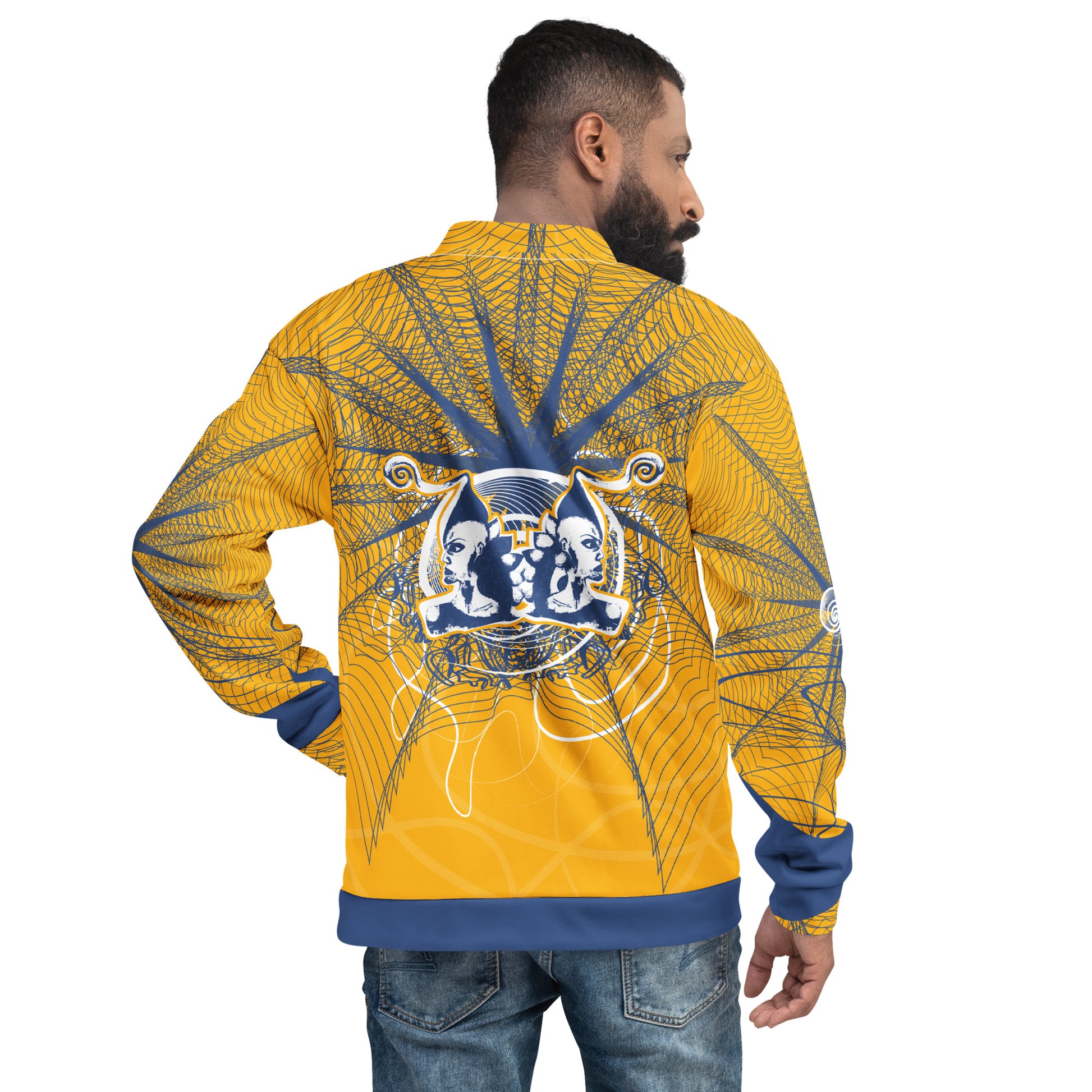 Back view of a golden yellow bomber jacket with intricate navy line art and a mirrored face emblem, combining bold cultural visuals with modern streetwear from the Secret Chambers of I and I collection.