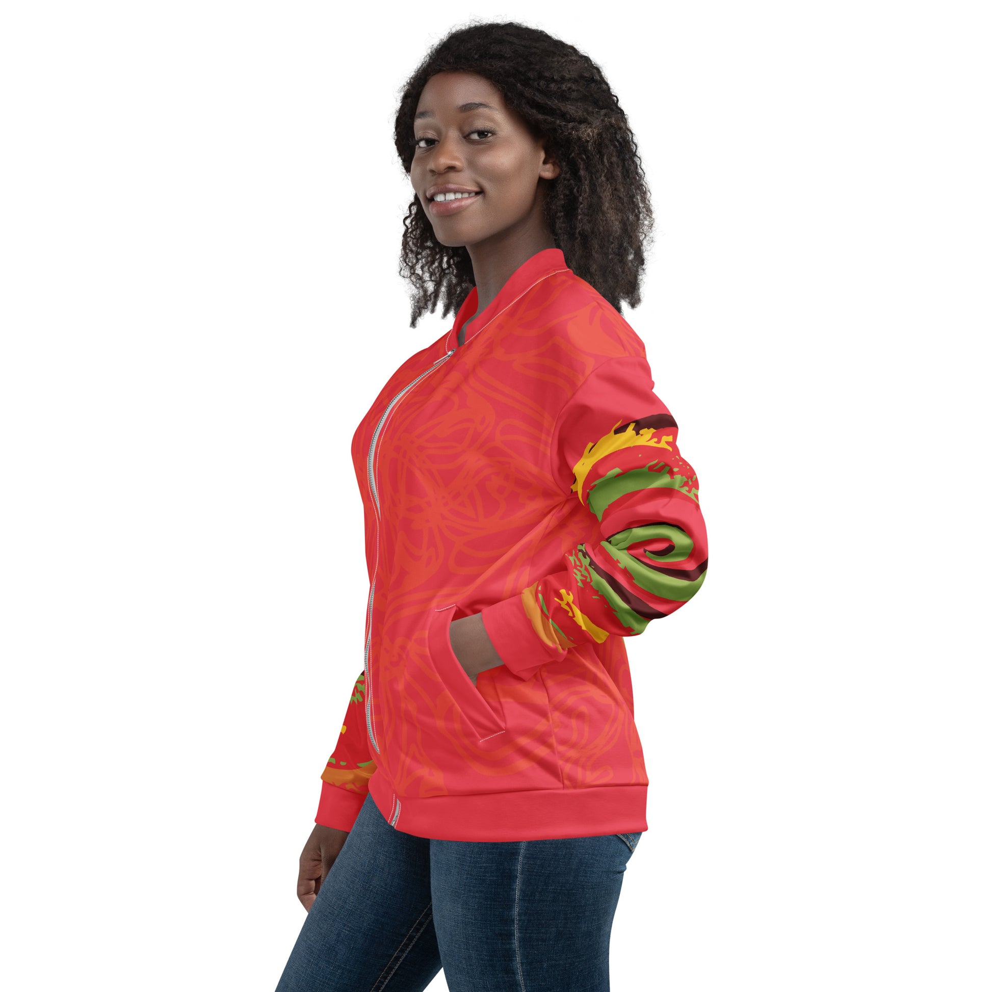 Red bomber jacket with vibrant swirl sleeve details and mirrored face design on the back, inspired by cultural art and bold self-expression.