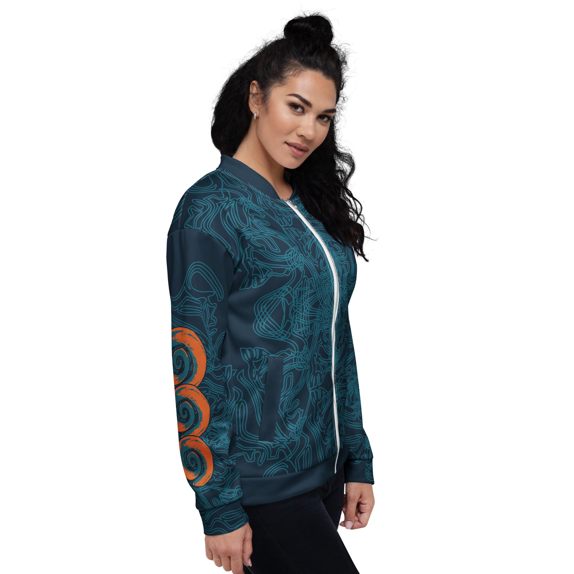Side front view of a navy blue bomber jacket with intricate cyan patterns, orange circular sleeve accents, and a zip-up closure, on a model.