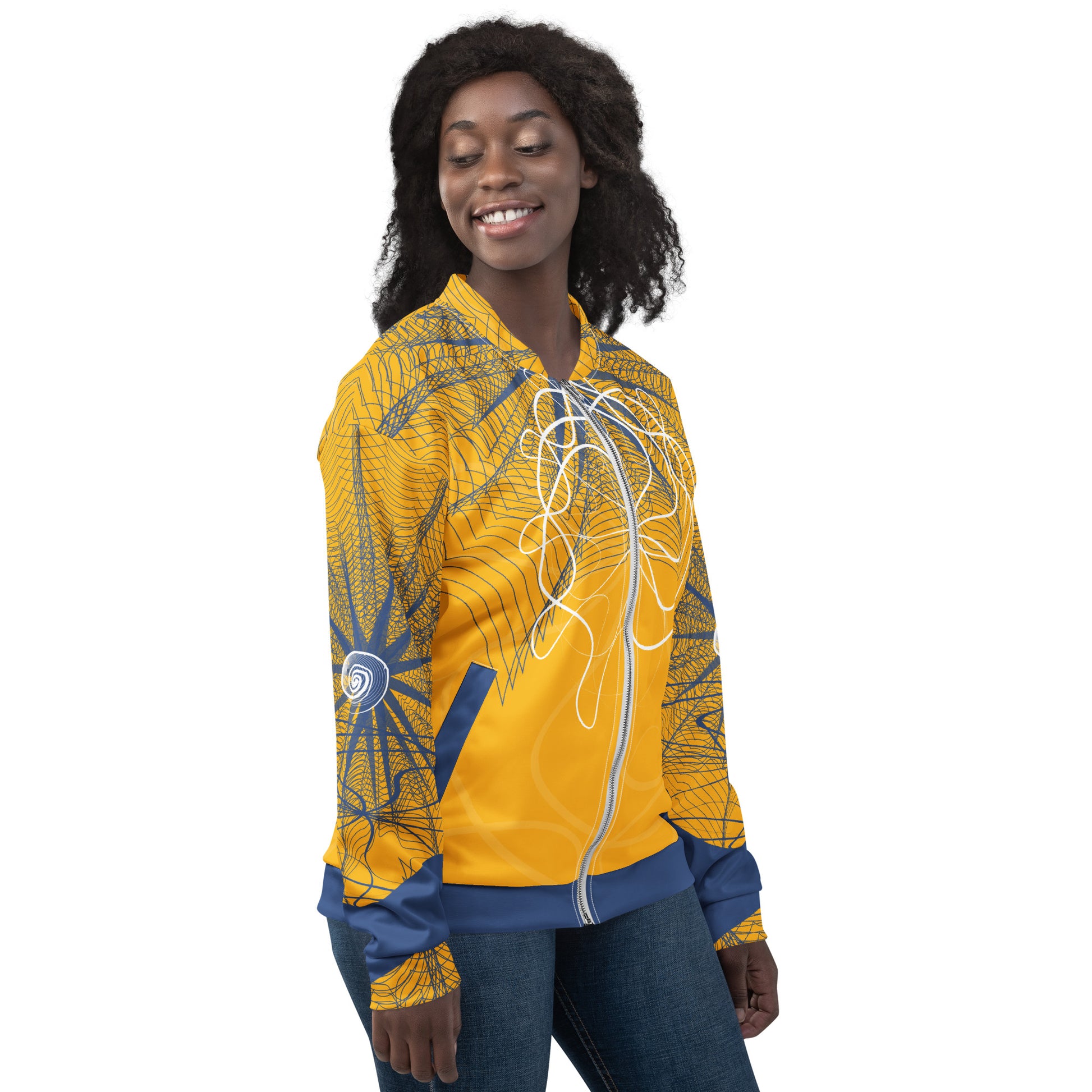 Front view of a golden yellow bomber jacket featuring navy geometric linework and flowing white abstract patterns, blending streetwear style with hand-drawn artistic energy.