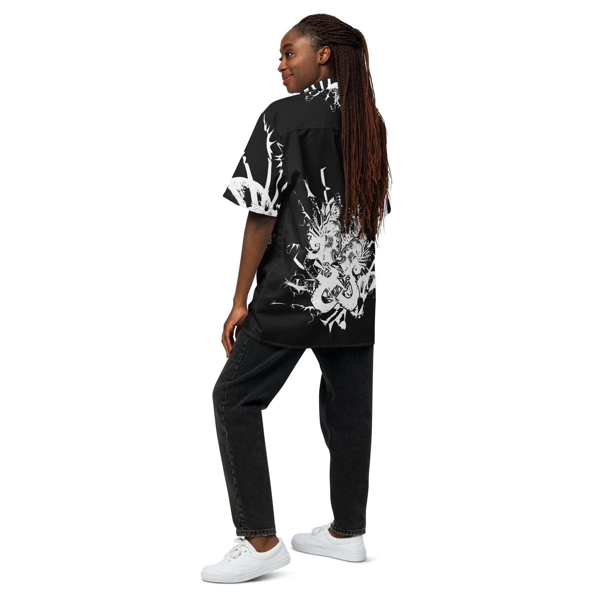 Back view of all-over print unisex button shirt by K.L.O.E showcasing intricate white hand-drawn illustration of two abstract faces intertwined with organic shapes and cultural motifs—celebrating artistic expression, identity, and evolution.