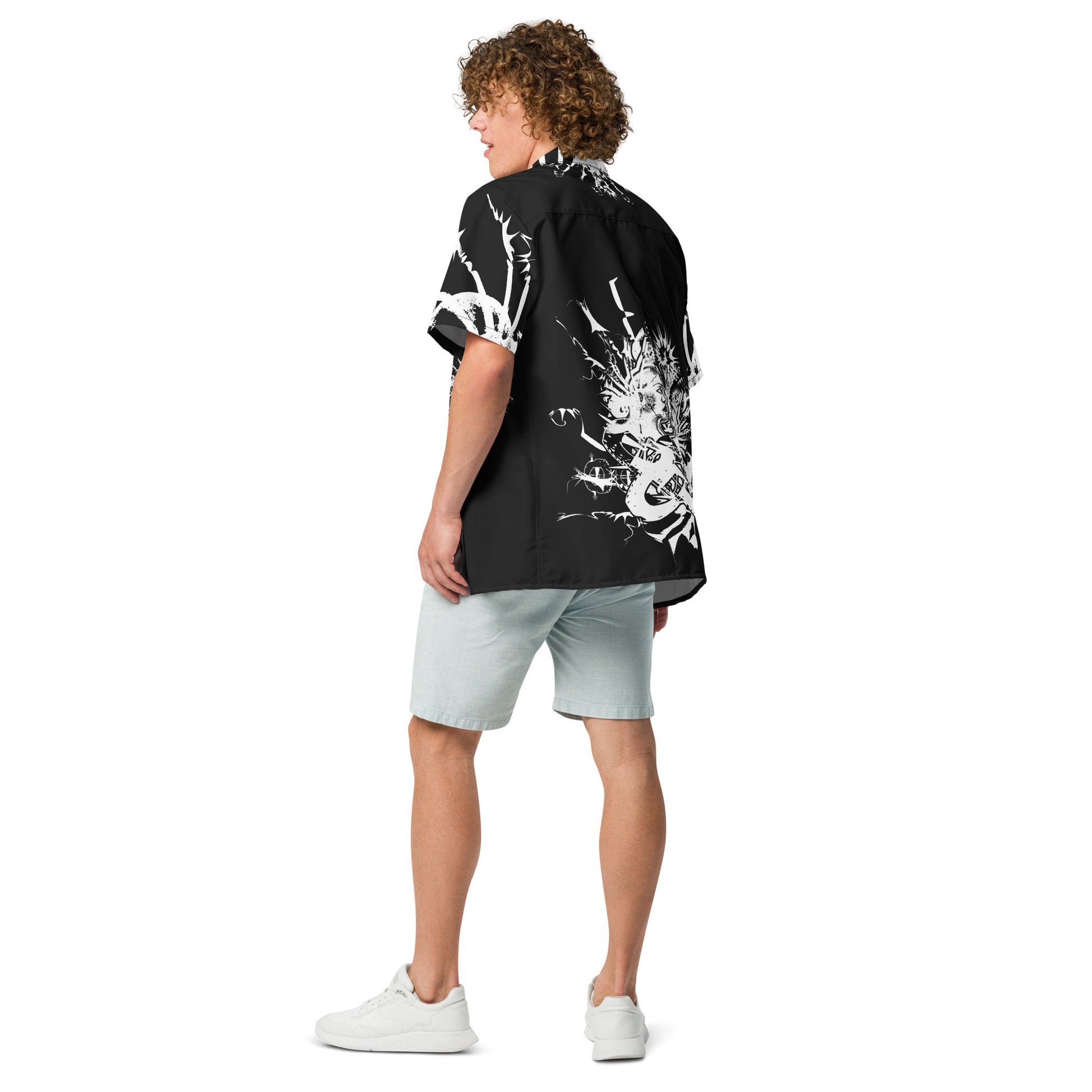 Back view of all-over print unisex button shirt by K.L.O.E showcasing intricate white hand-drawn illustration of two abstract faces intertwined with organic shapes and cultural motifs—celebrating artistic expression, identity, and evolution.