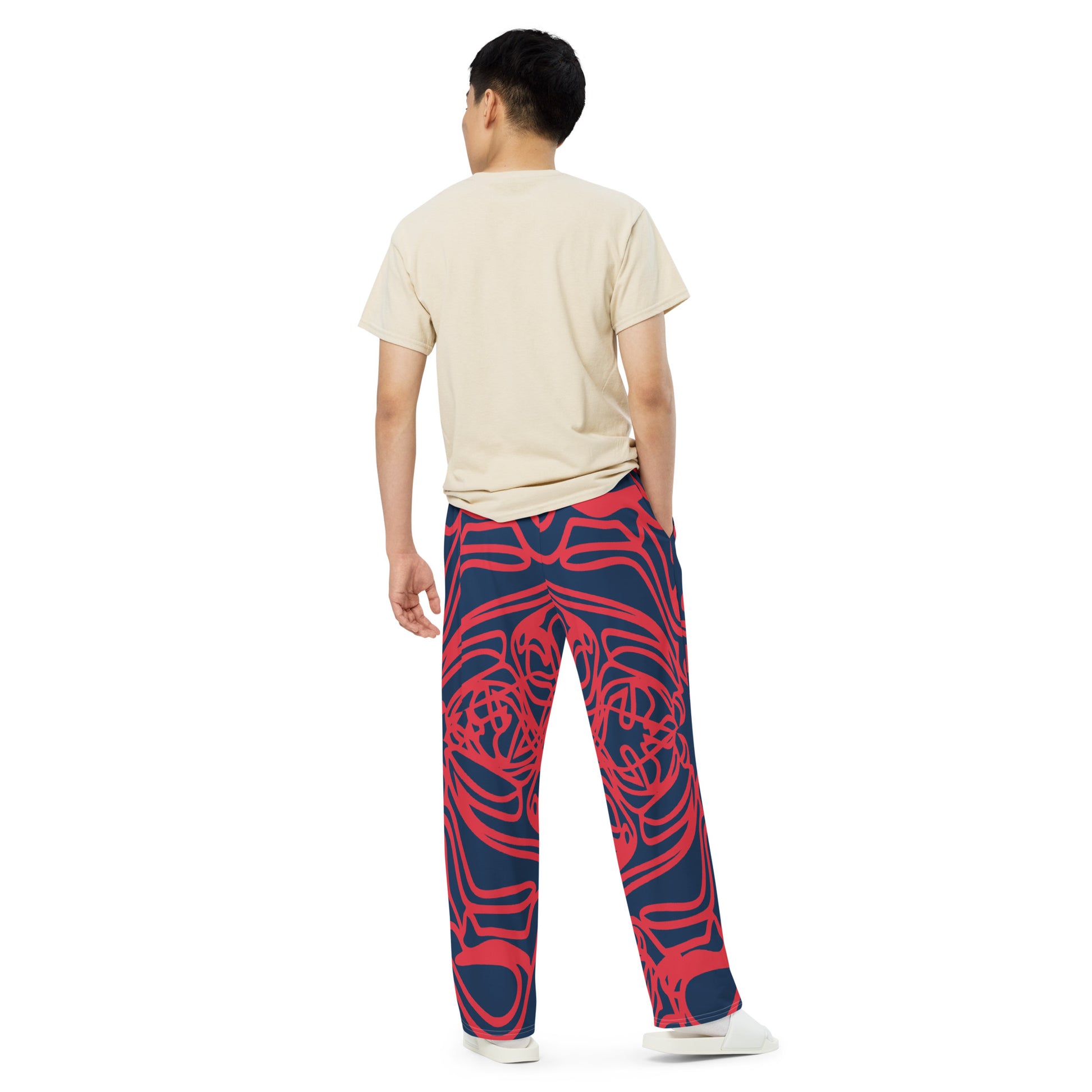 Bold navy and red streetwear pants featuring hand-drawn tribal patterns, culturally inspired and designed for a modern, relaxed fit with an edgy, artistic style – KLOE fashion.