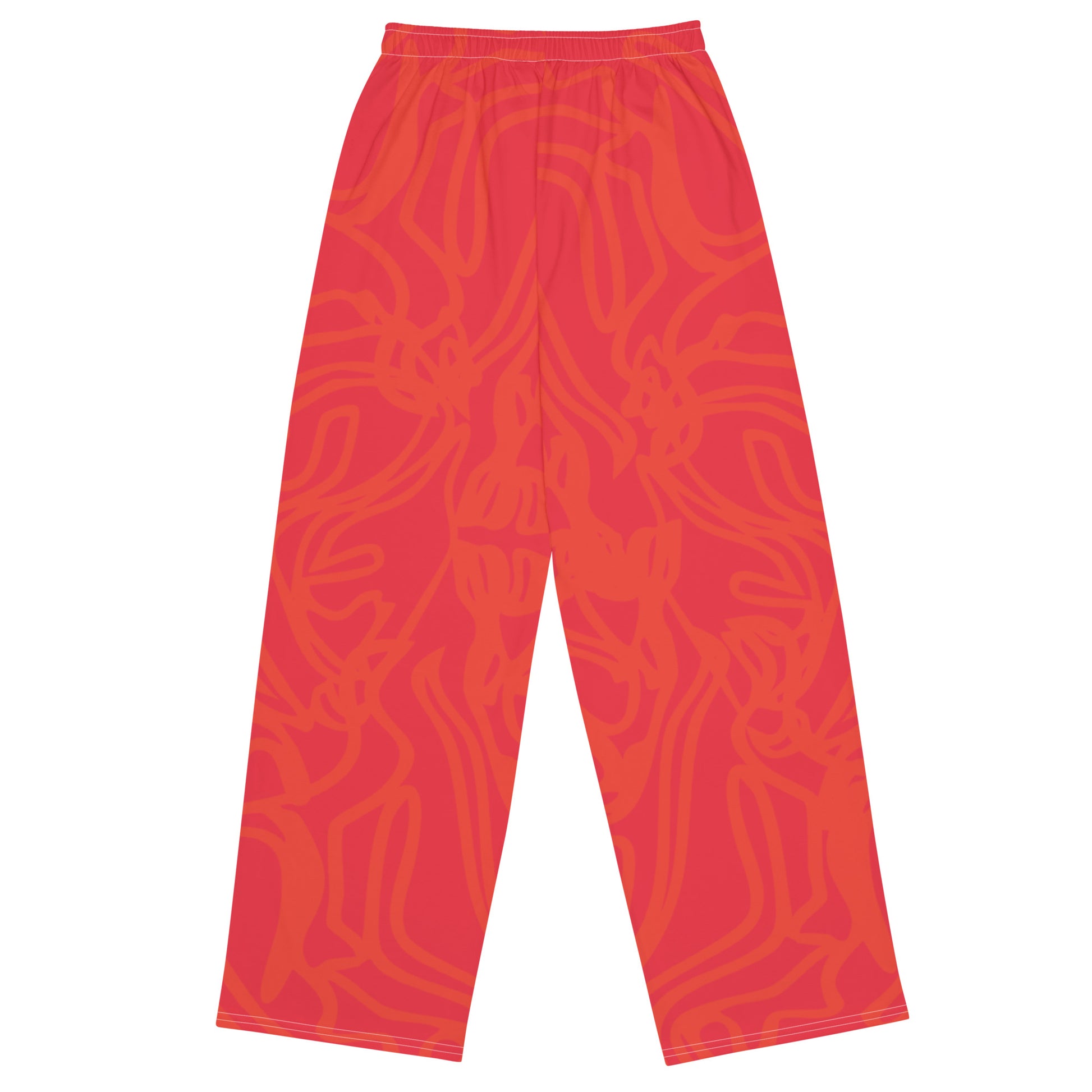 Wide-leg pants with a red base and abstract brushstroke side panels in yellow, green, and black, inspired by bold color play and cultural expression.