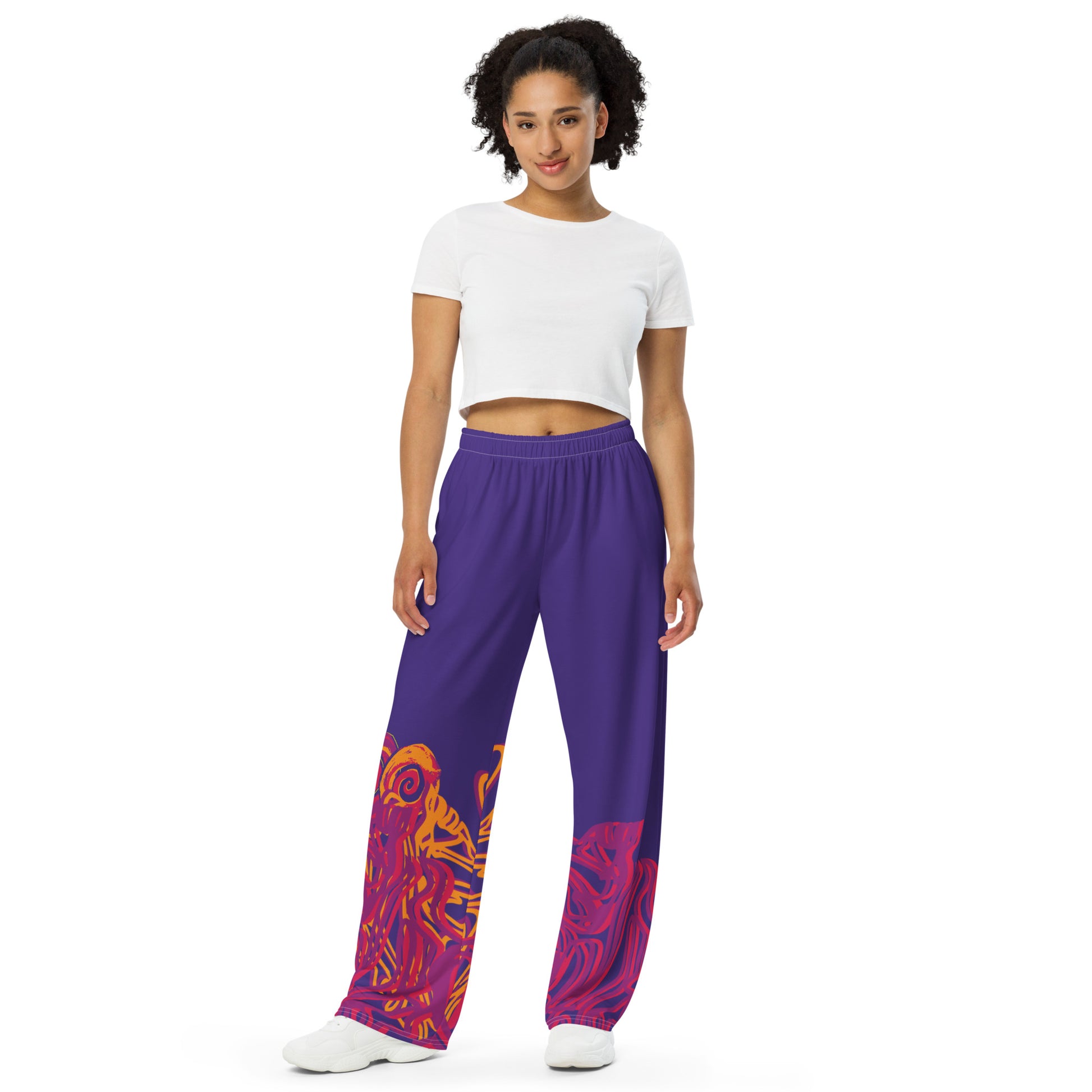 Bold purple wide-leg pants with vibrant orange and red culturally inspired patterns, featuring abstract swirling designs — expressive fashion from KLOE’s The Secret Chambers of I & I collection, on a model.