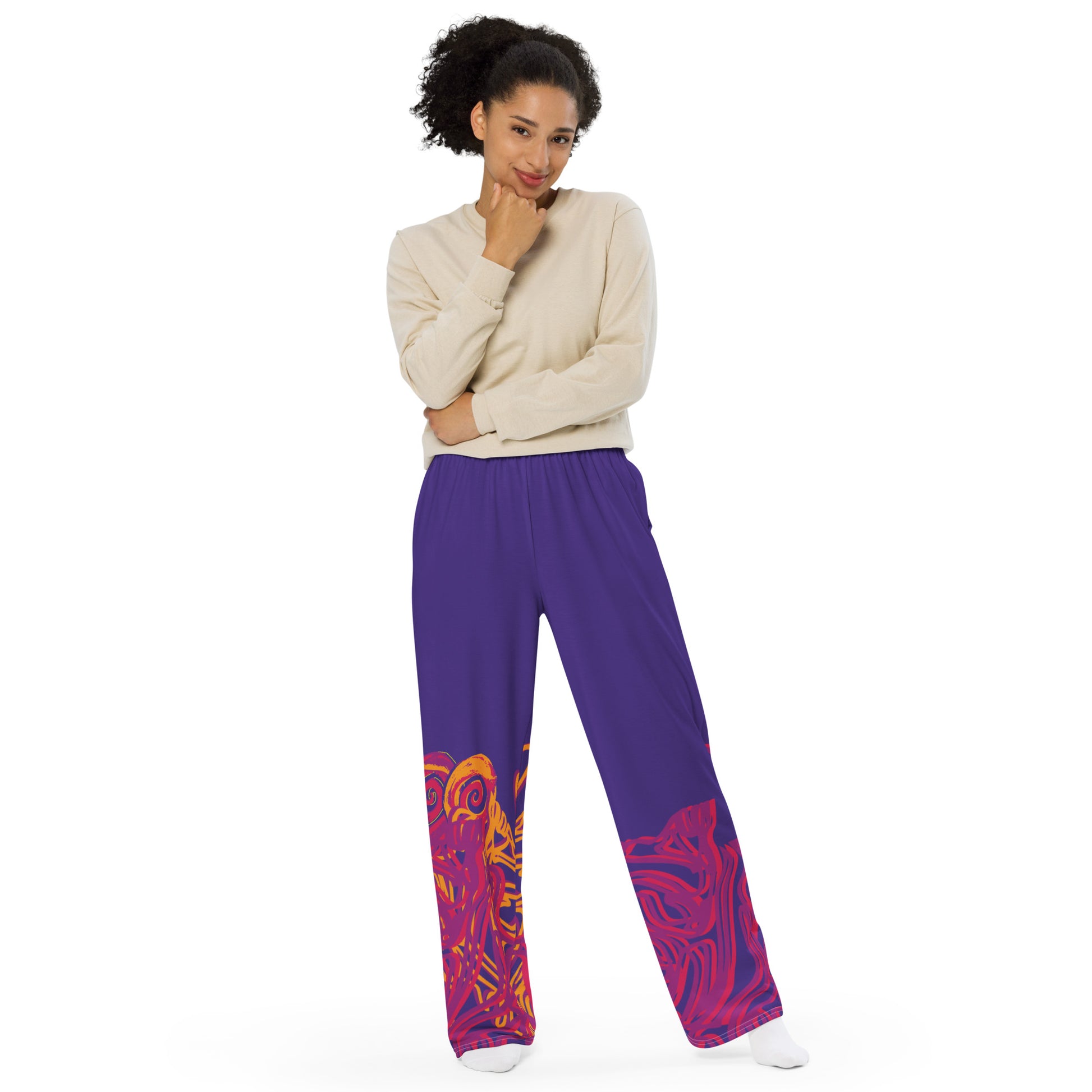 Bold purple wide-leg pants with vibrant orange and red culturally inspired patterns, featuring abstract swirling designs — expressive fashion from KLOE’s The Secret Chambers of I & I collection, on a model.