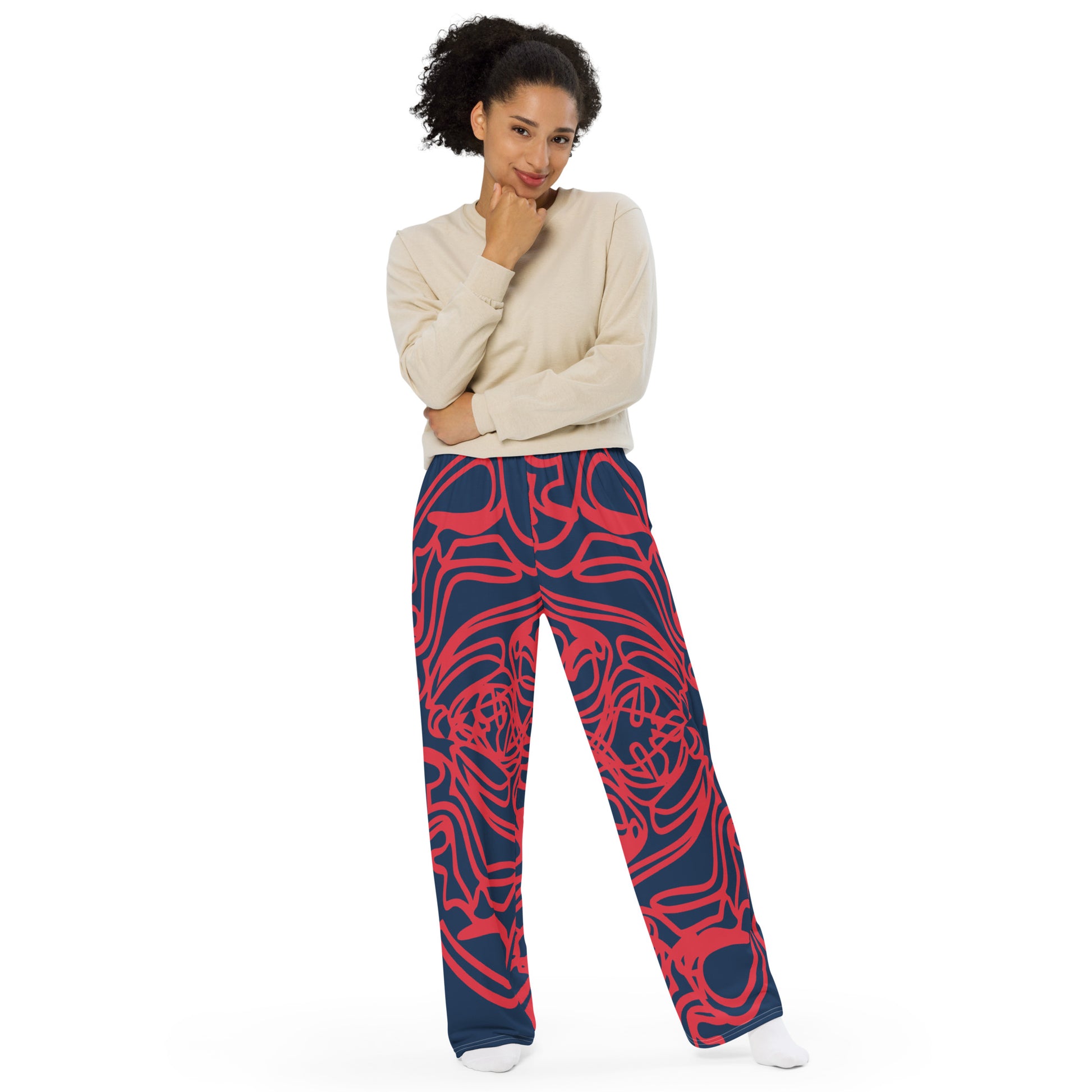 Bold navy and red streetwear pants featuring hand-drawn tribal patterns, culturally inspired and designed for a modern, relaxed fit with an edgy, artistic style – KLOE fashion.