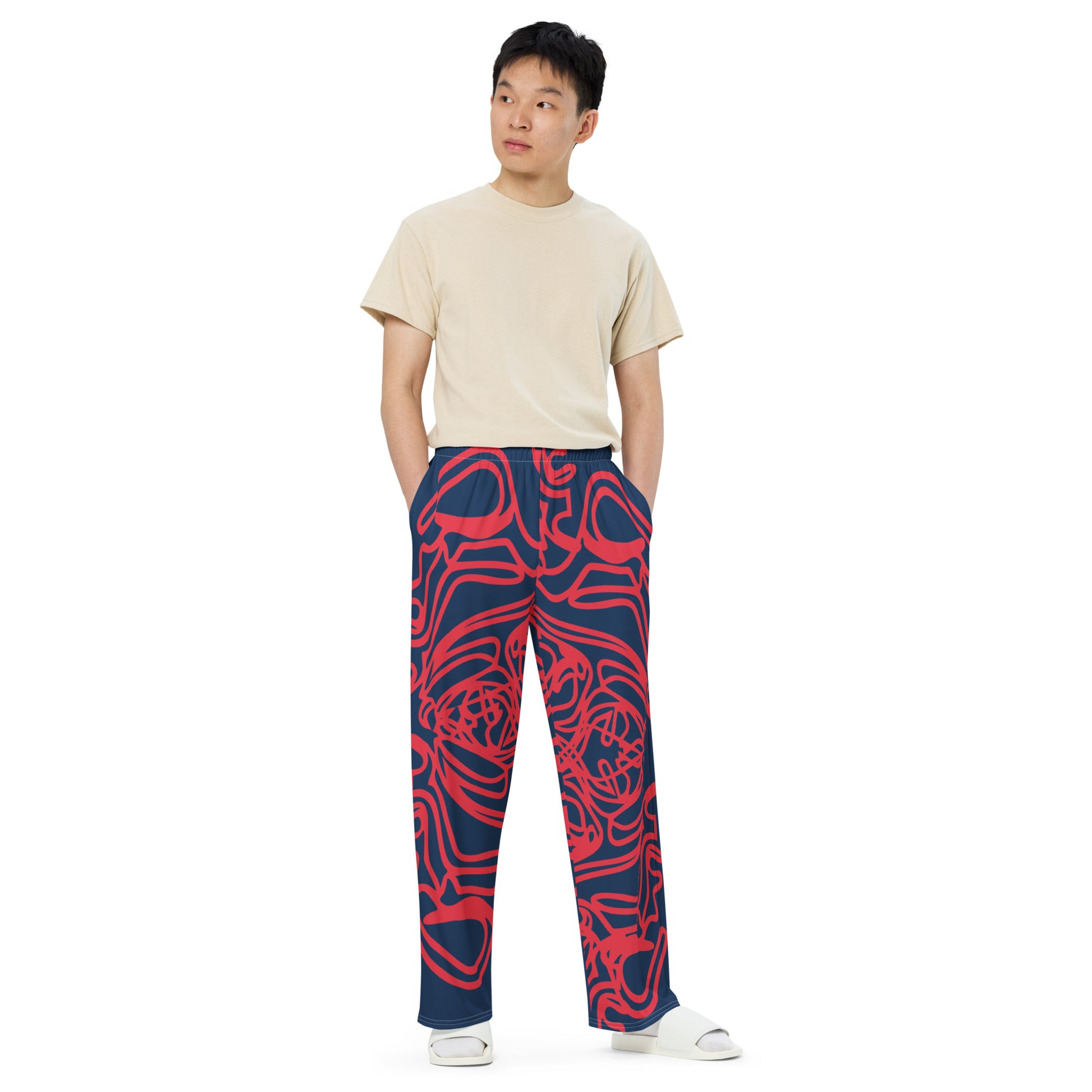 Bold navy and red streetwear pants featuring hand-drawn tribal patterns, culturally inspired and designed for a modern, relaxed fit with an edgy, artistic style – KLOE fashion.