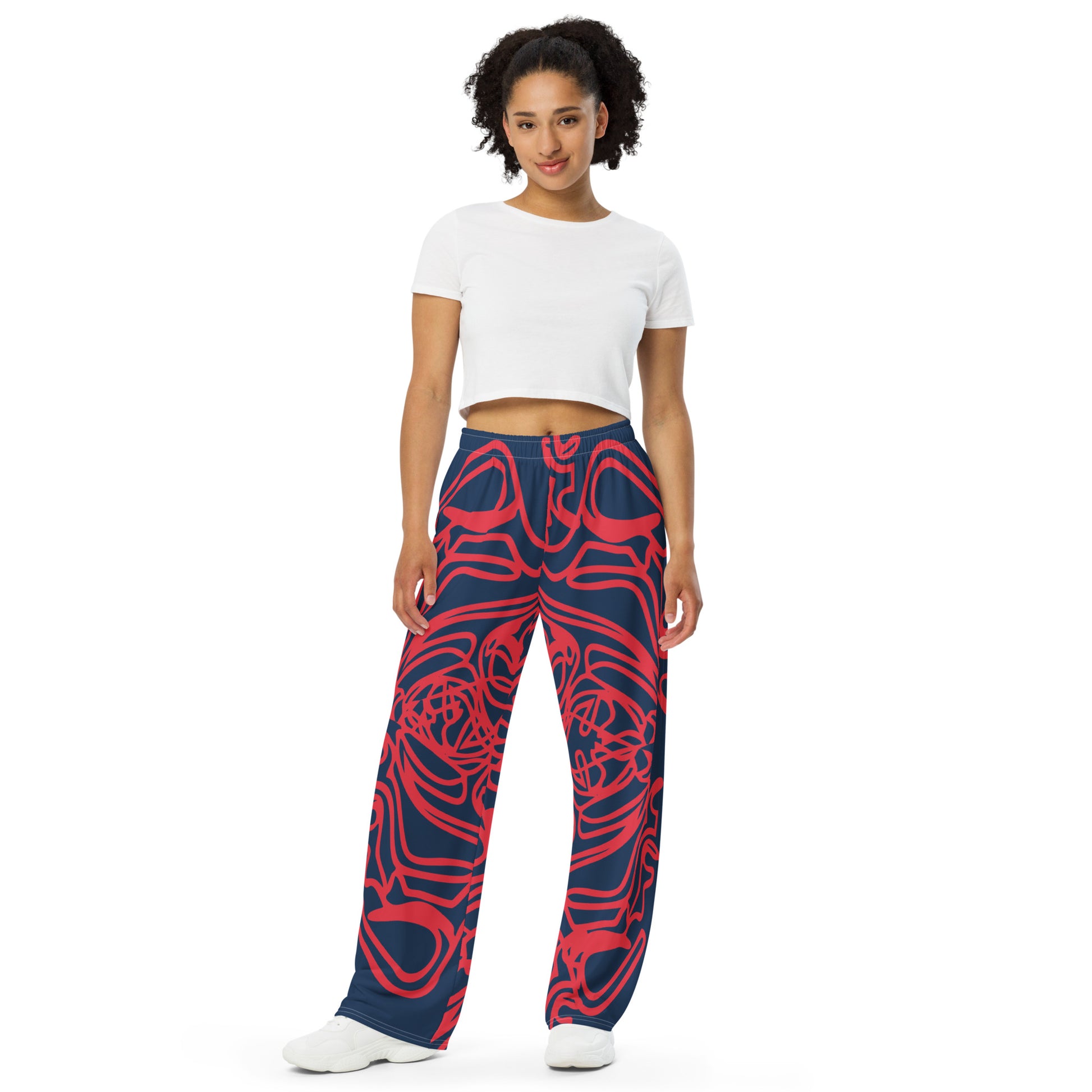 Bold navy and red streetwear pants featuring hand-drawn tribal patterns, culturally inspired and designed for a modern, relaxed fit with an edgy, artistic style – KLOE fashion.