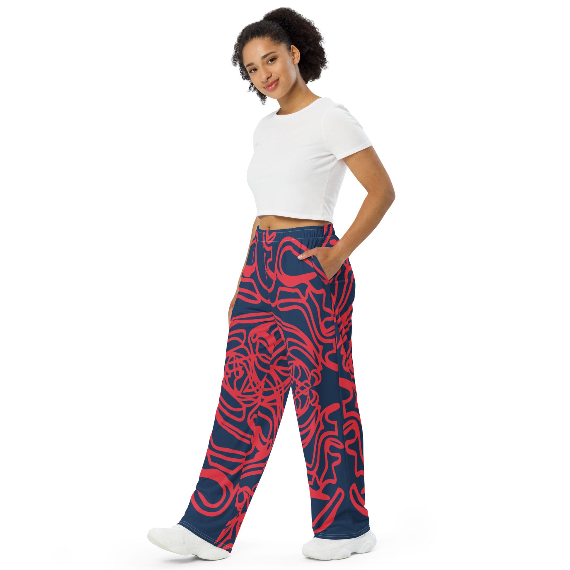 Bold navy and red streetwear pants featuring hand-drawn tribal patterns, culturally inspired and designed for a modern, relaxed fit with an edgy, artistic style – KLOE fashion.