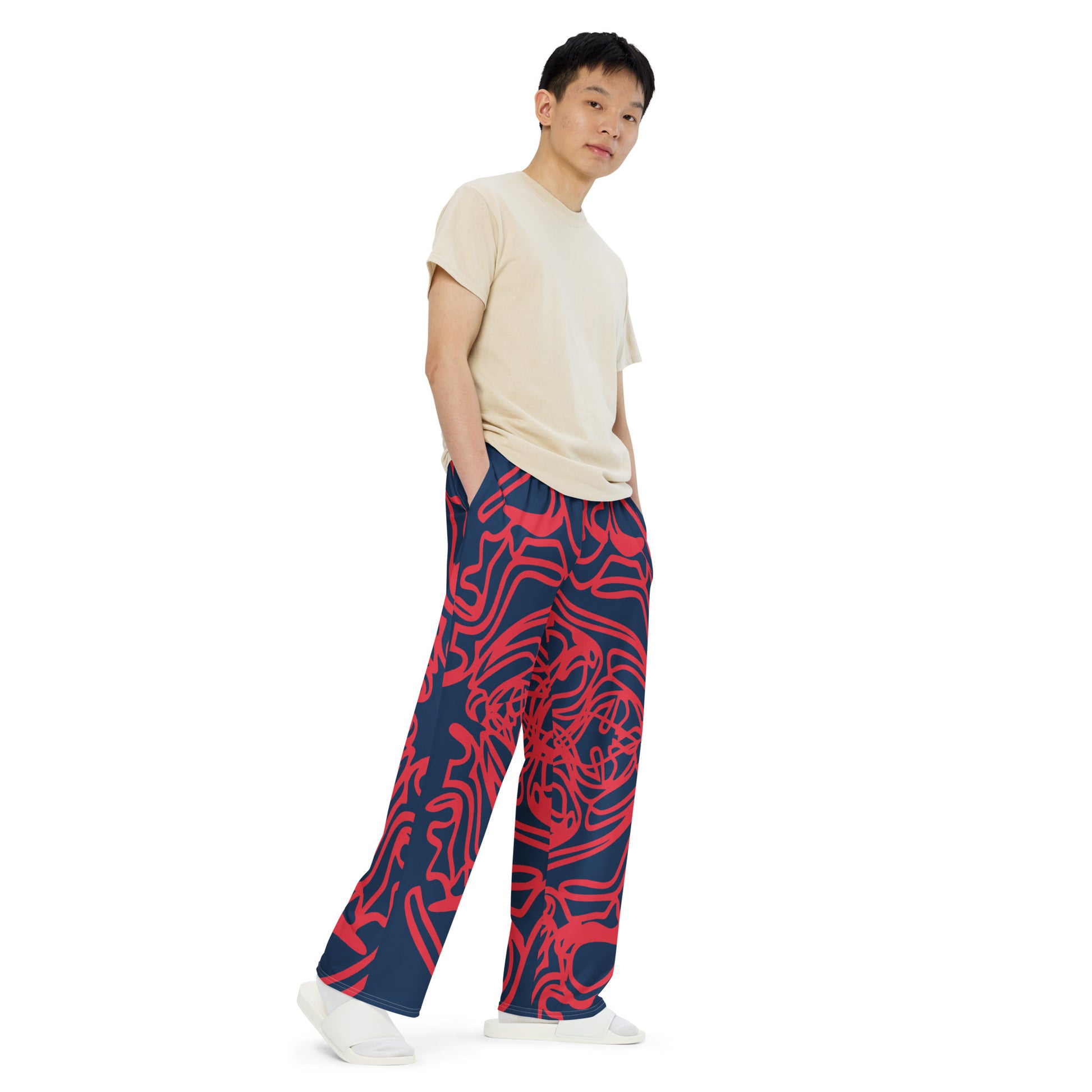 Bold navy and red streetwear pants featuring hand-drawn tribal patterns, culturally inspired and designed for a modern, relaxed fit with an edgy, artistic style – KLOE fashion.