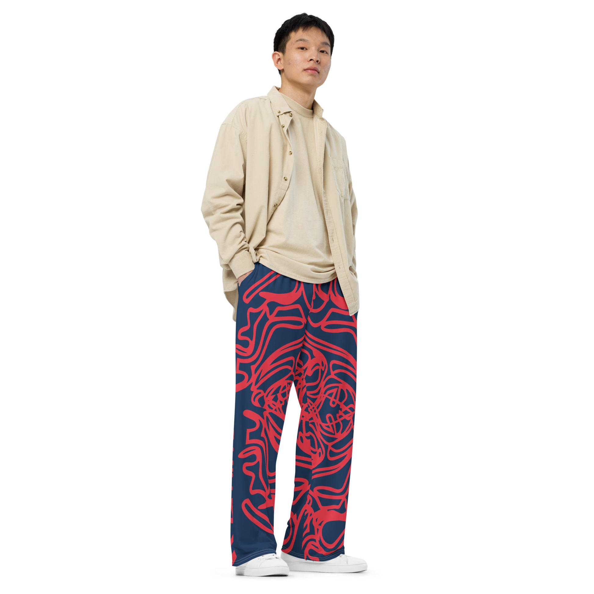 Bold navy and red streetwear pants featuring hand-drawn tribal patterns, culturally inspired and designed for a modern, relaxed fit with an edgy, artistic style – KLOE fashion.