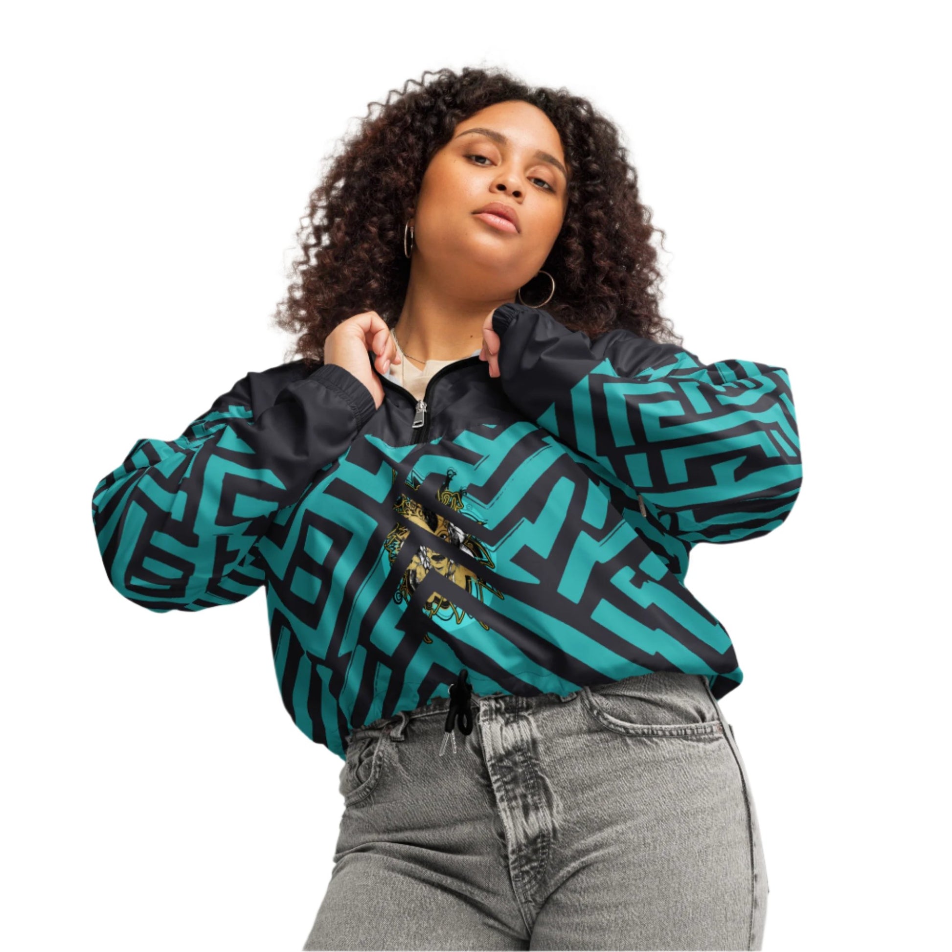 Confident woman wearing Kloe Store cropped windbreaker with bold green and black geometric patterns, paired with high-waisted grey jeans, showcasing trendy and modern streetwear fashion.