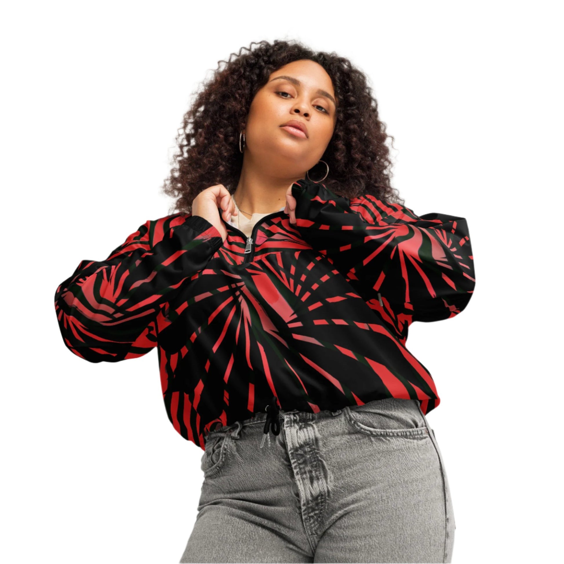 The model wearing red and black cropped women's windbreaker from Kloe Store featuring a bold swirling pattern, adjustable drawstring hem, and hood, showcasing trendy and stylish outerwear for modern street fashion.