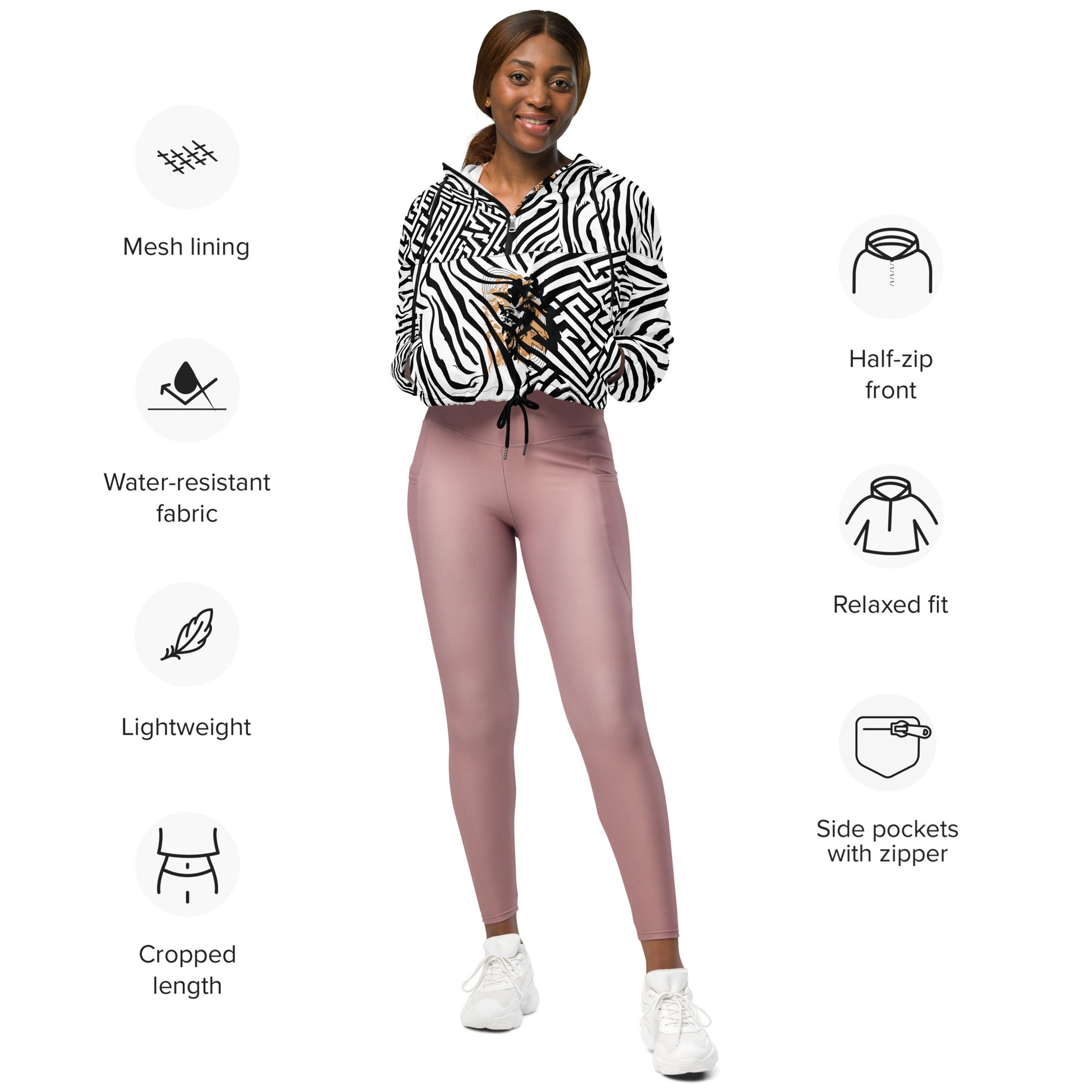 The model wearing black and white zebra print cropped windbreaker from Kloe Store featuring bold geometric patterns and an artistic face design, perfect for trendy streetwear fashion with an edgy, modern look, showing the product specifications.