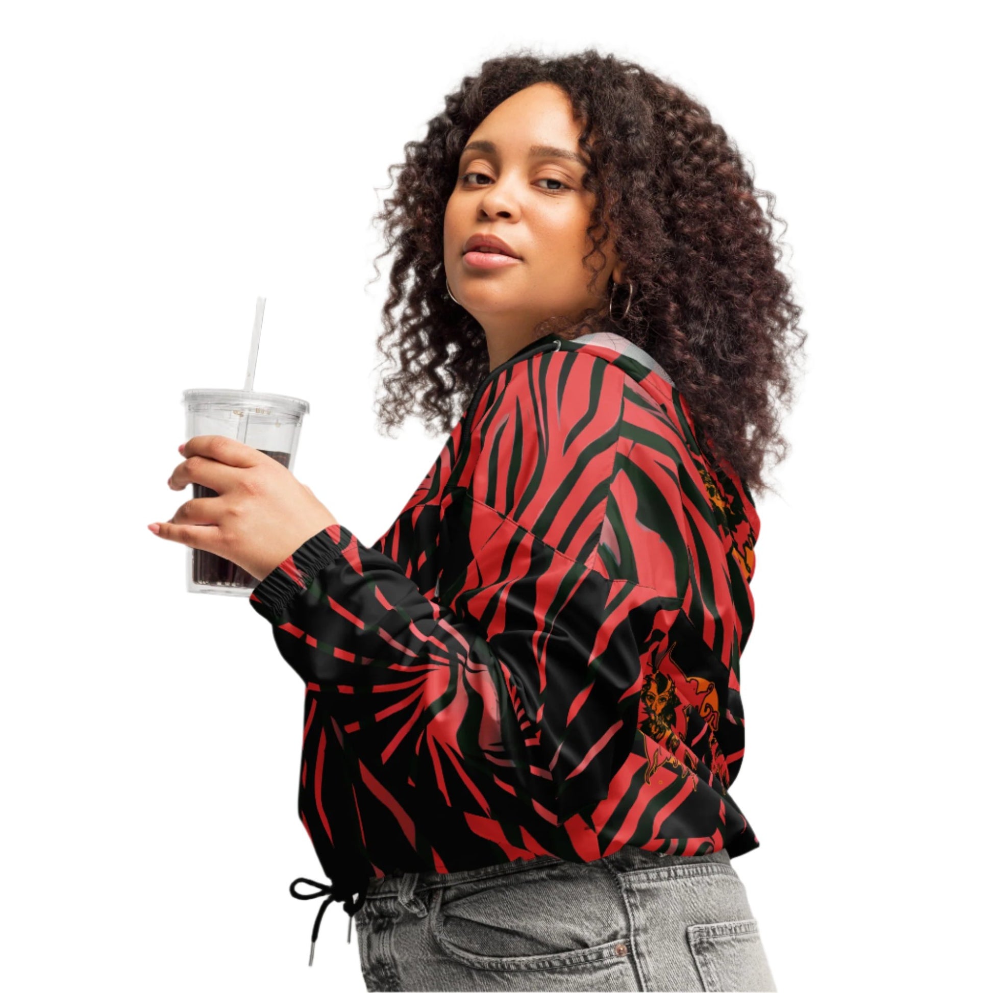 The model red and black cropped women's windbreaker from Kloe Store featuring a bold swirling pattern, adjustable drawstring hem, and hood, showcasing trendy and stylish outerwear for modern street fashion.