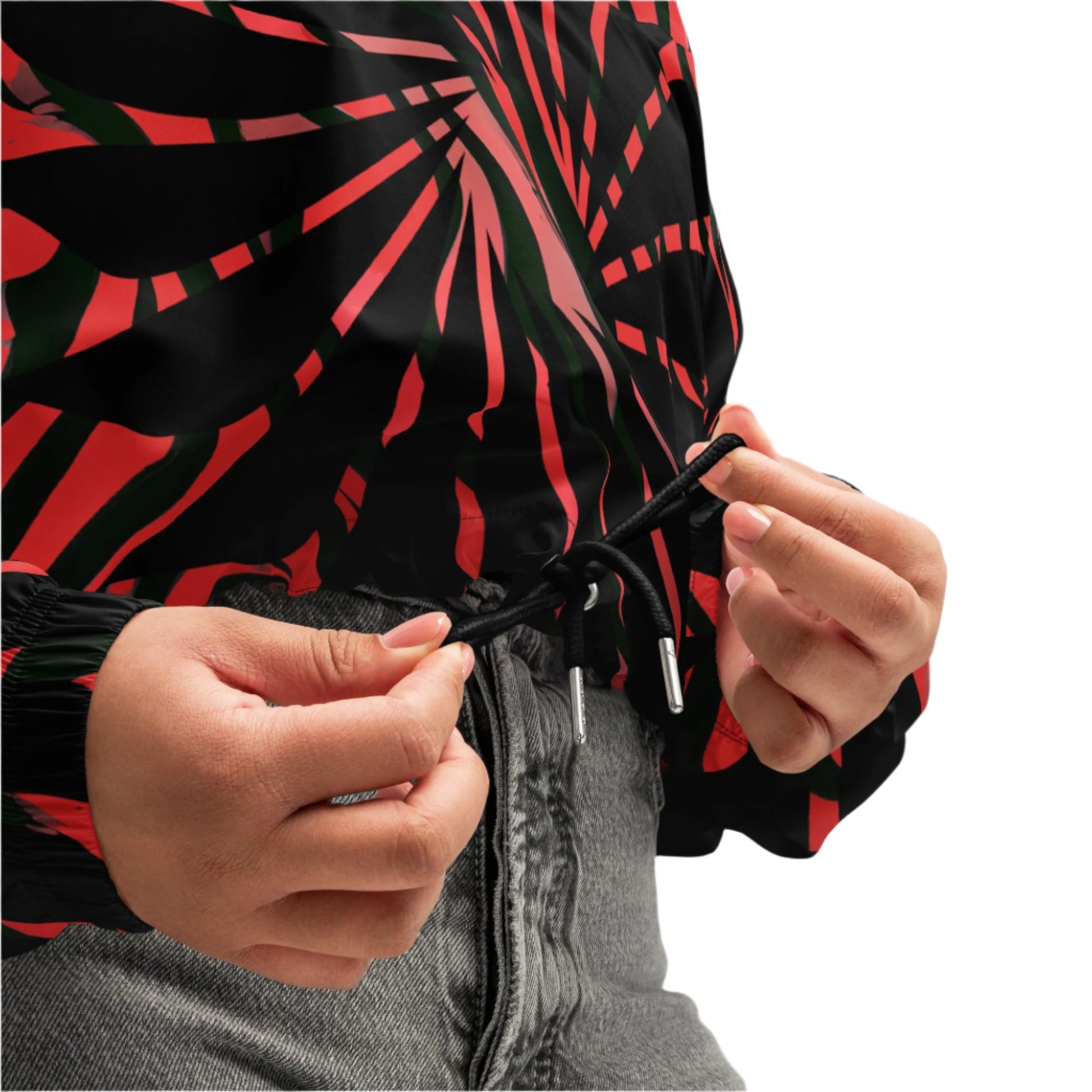 Red and black cropped women's windbreaker from Kloe Store featuring a bold swirling pattern, adjustable drawstring hem, and hood, showcasing trendy and stylish outerwear for modern street fashion, detailed view.