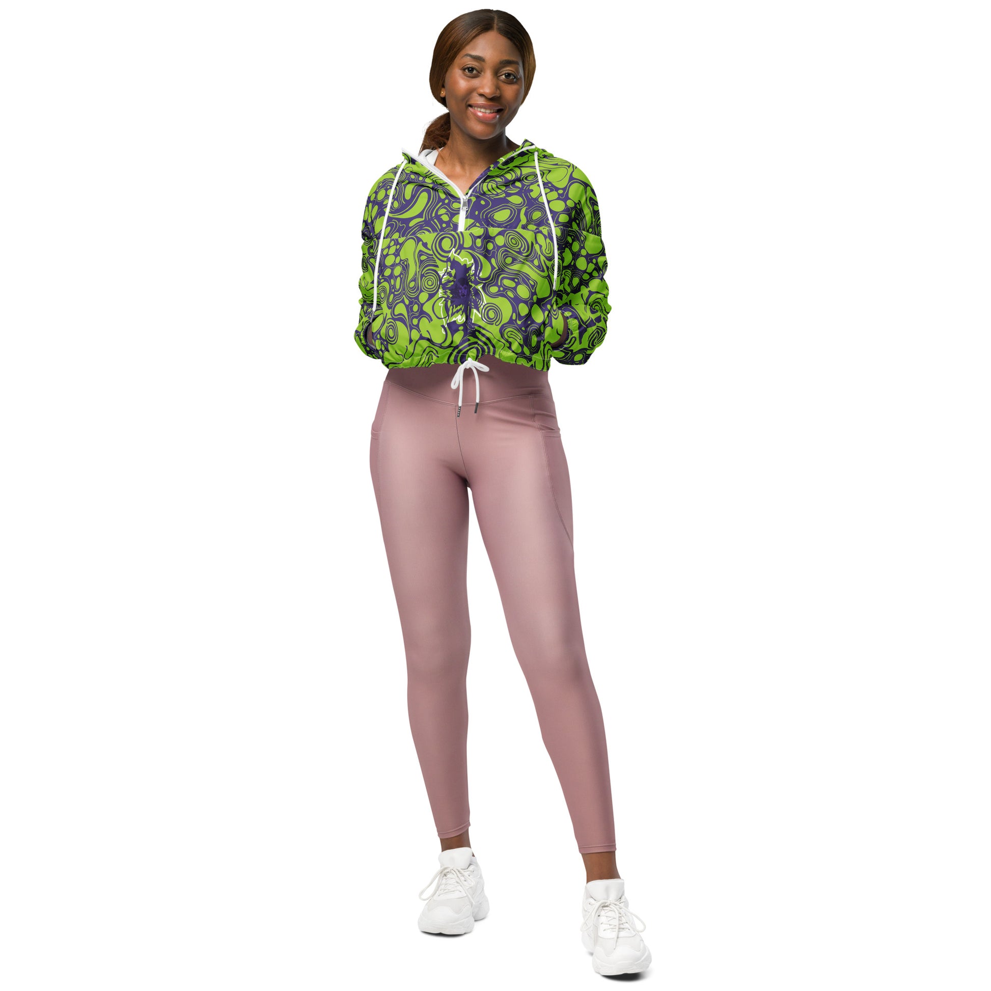 The model wearing green and purple cropped windbreaker from Kloe Store featuring bold abstract patterns and a unique artistic face design, ideal for a trendy streetwear look.