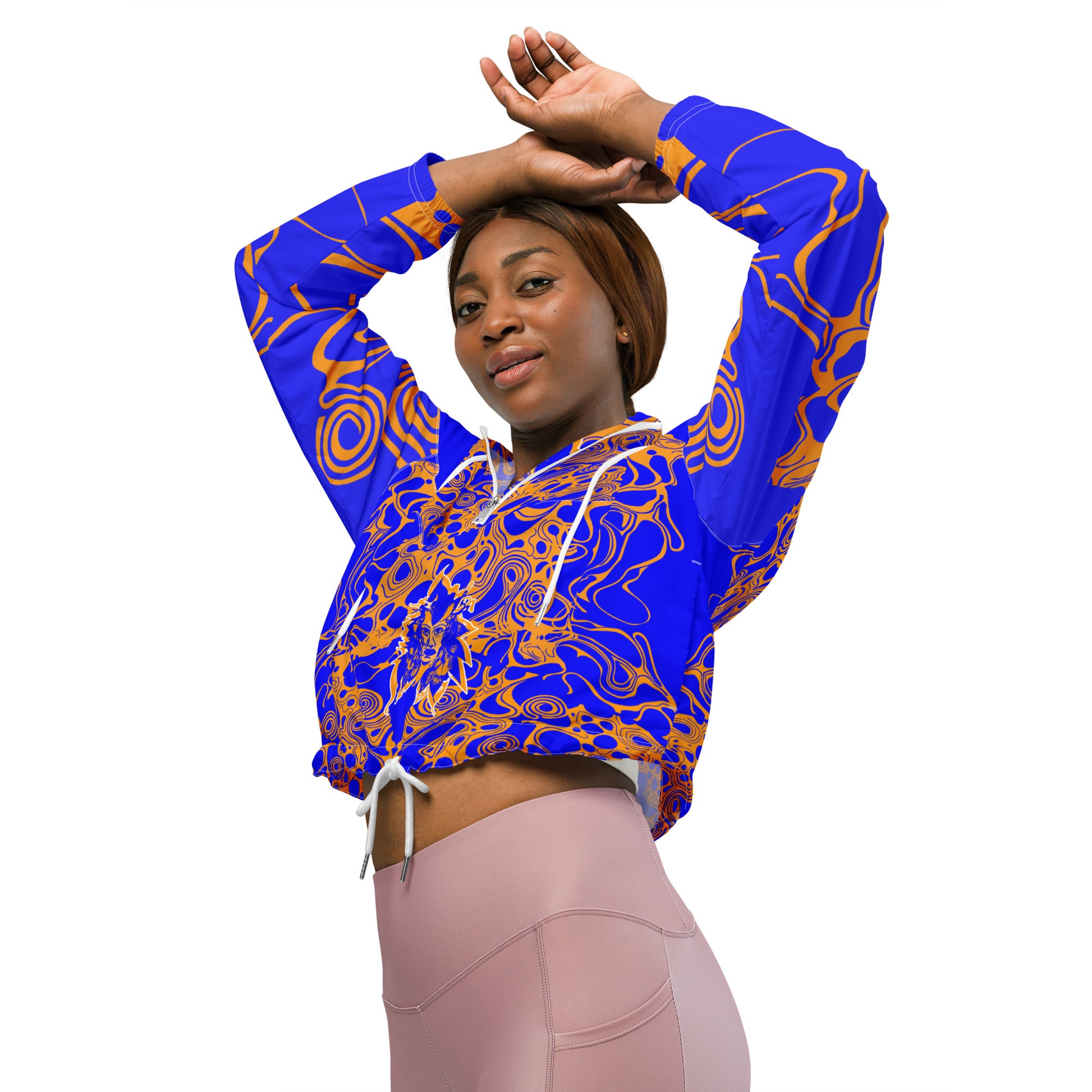Product mockup - model wearing a vibrant blue and orange cropped windbreaker from Kloe Store featuring abstract swirl pattern, a front zipper, drawstring hood, and elastic cuffs, offering a stylish and modern streetwear look.