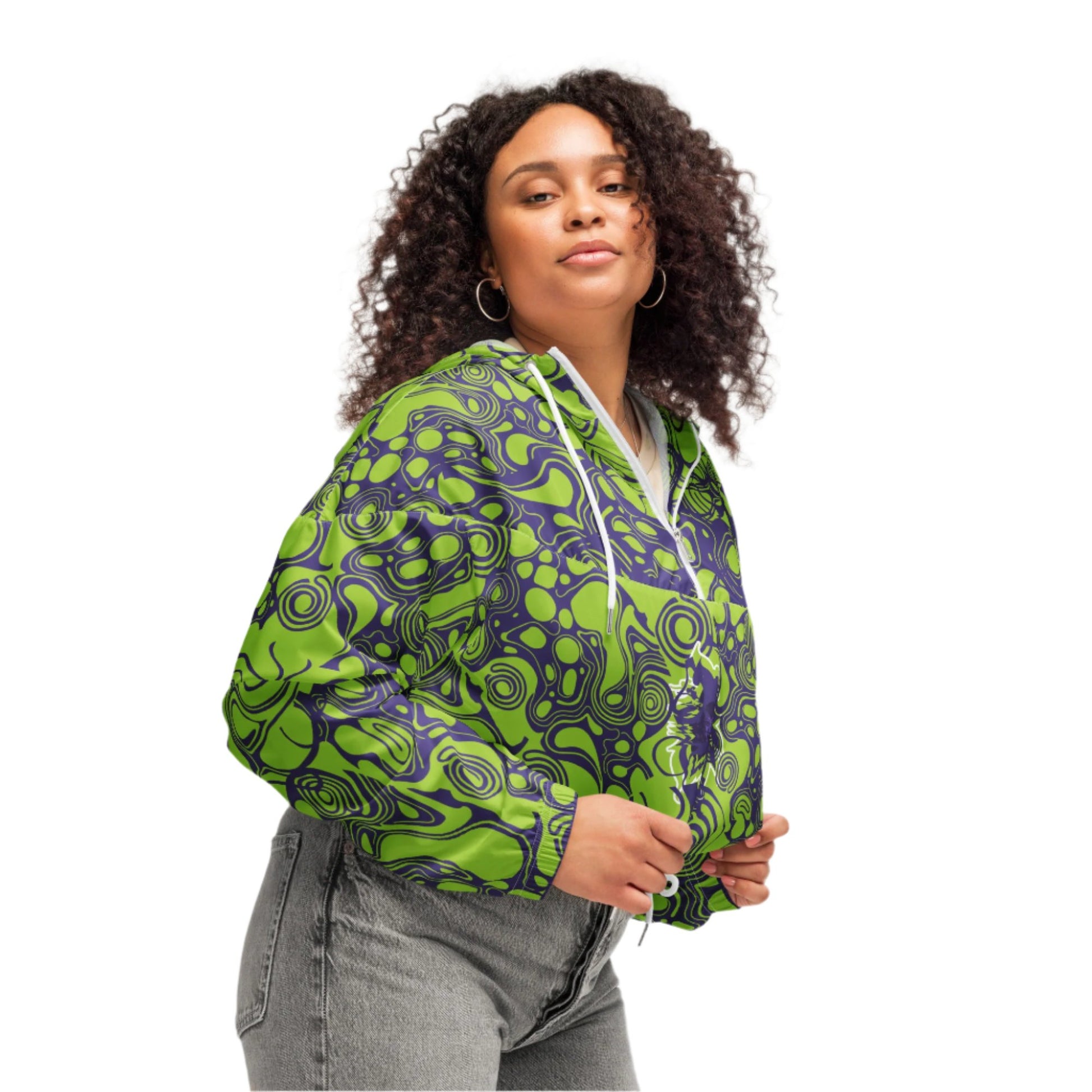The model wearing green and purple cropped windbreaker from Kloe Store featuring bold abstract patterns and a unique artistic face design, ideal for a trendy streetwear look.