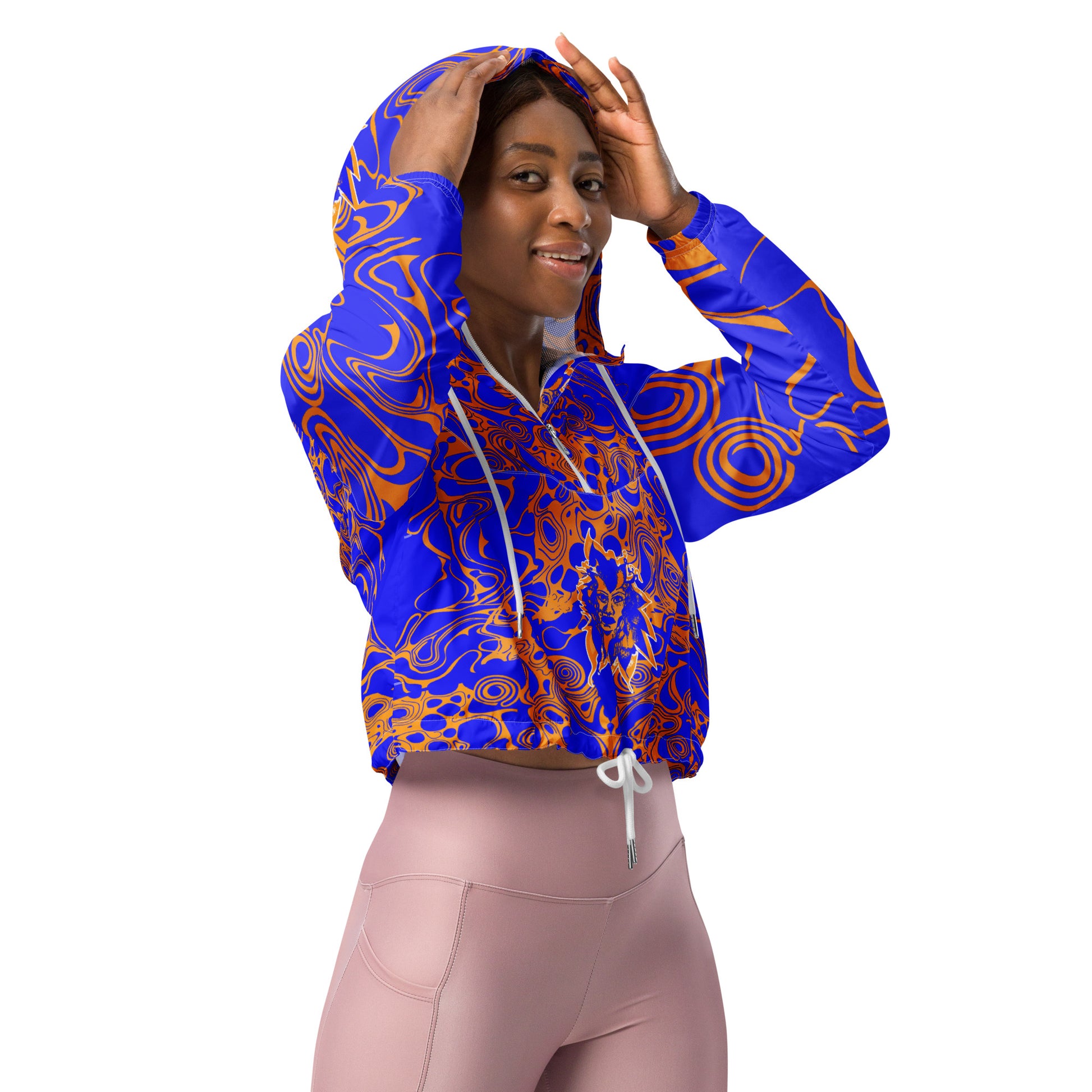 Product mockup - model wearing a vibrant blue and orange cropped windbreaker from Kloe Store featuring abstract swirl pattern, a front zipper, drawstring hood, and elastic cuffs, offering a stylish and modern streetwear look.