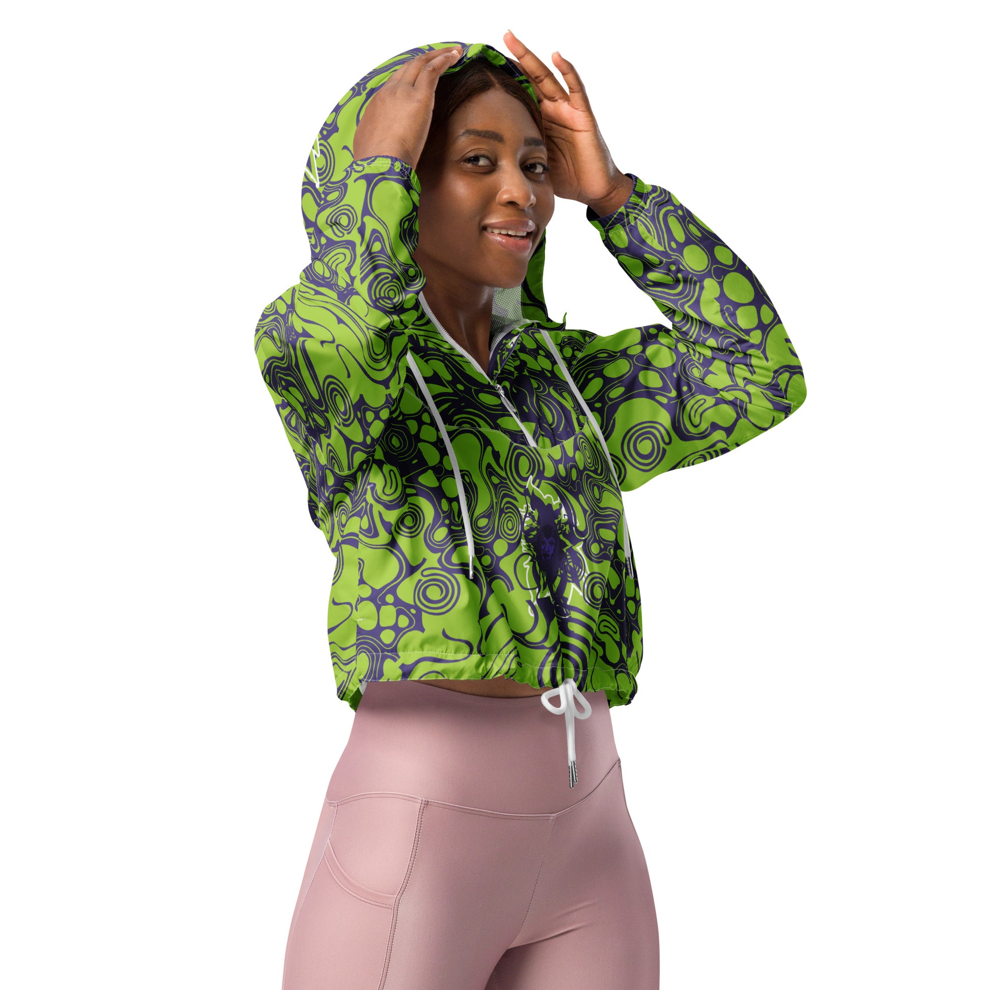 The model wearing green and purple cropped windbreaker from Kloe Store featuring bold abstract patterns and a unique artistic face design, ideal for a trendy streetwear look.