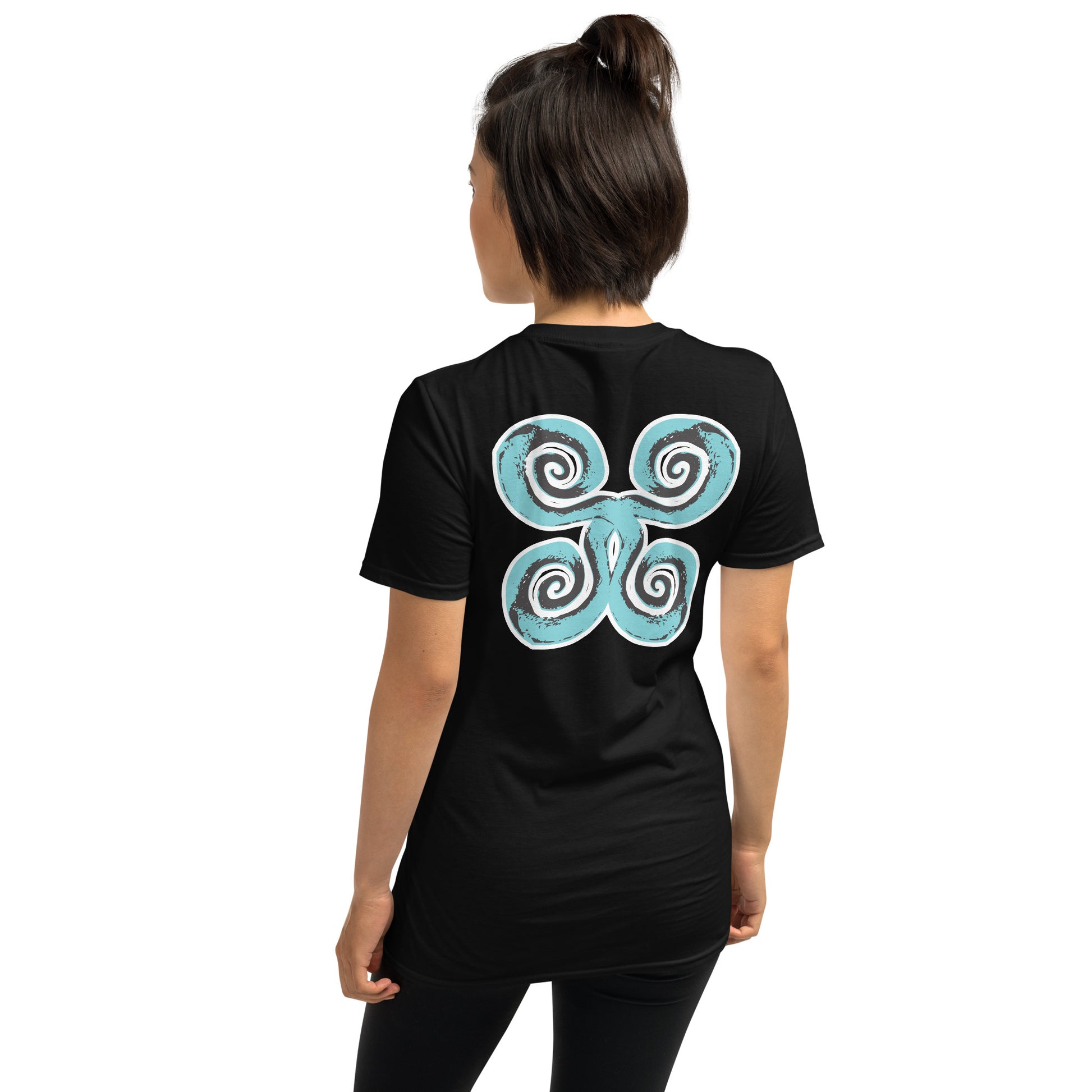 Back of black K.L.O.E. t-shirt with a bold, artistic design featuring four interconnected spirals in black and teal, inspired by cultural symbolism and bohemian artistry, worn by a model.