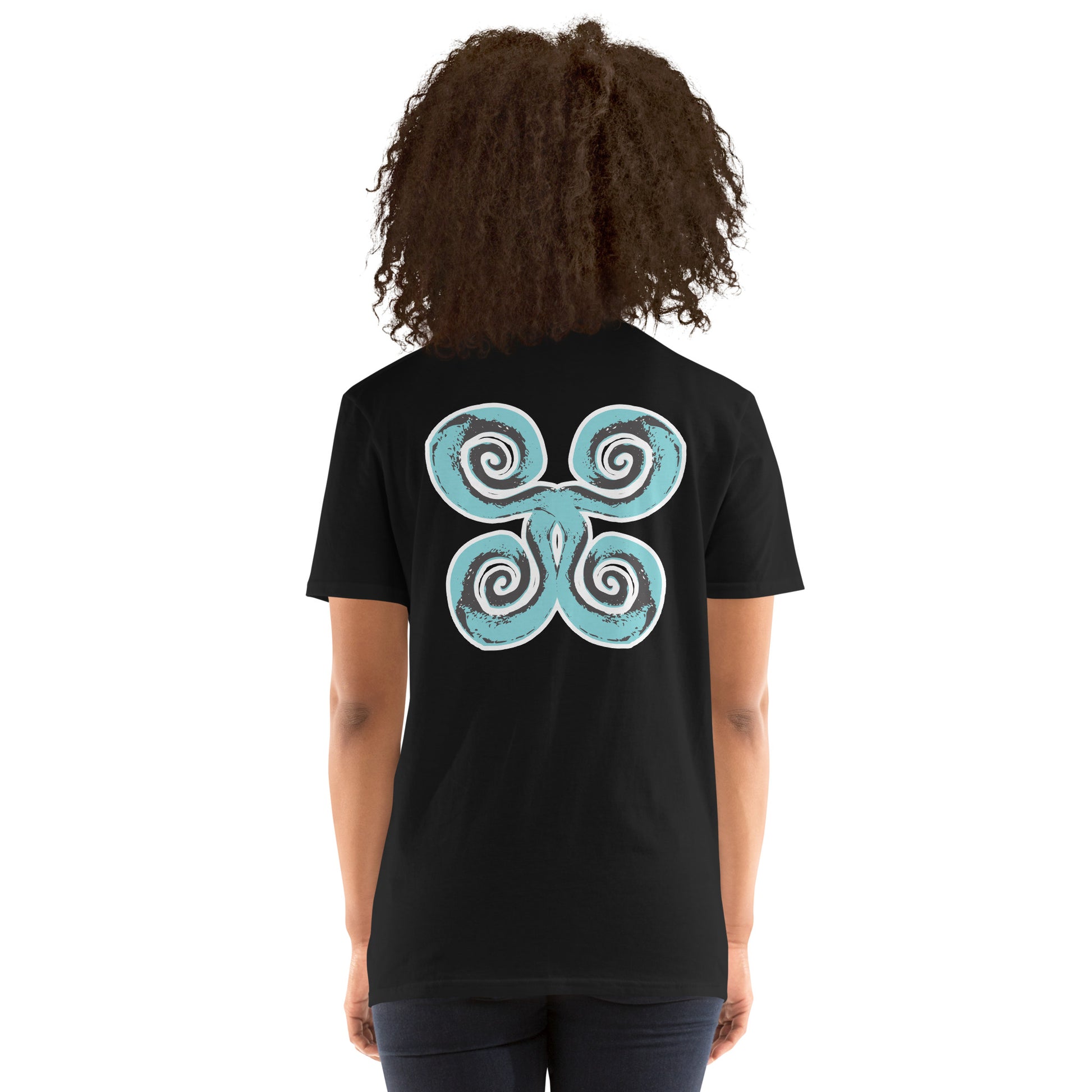 Back of black K.L.O.E. t-shirt with a bold, artistic design featuring four interconnected spirals in black and teal, inspired by cultural symbolism and bohemian artistry, worn by a model.