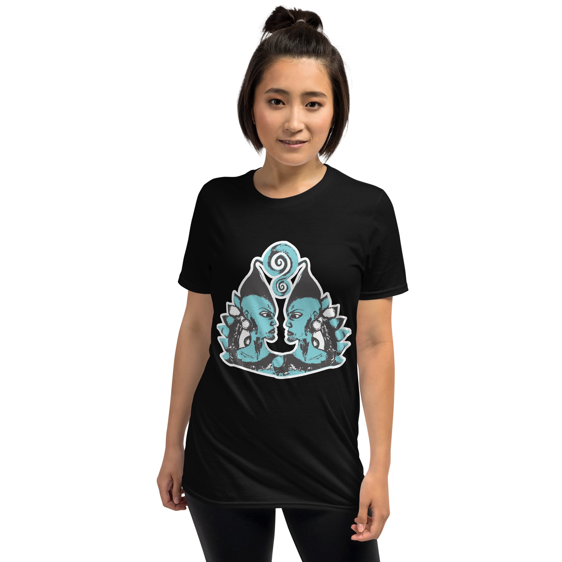 A model wearing black K.L.O.E. t-shirt showcasing a hand-drawn design of two mirrored faces in black and teal, embodying culturally inspired, bohemian style fashion focused on individuality and artistic expression.