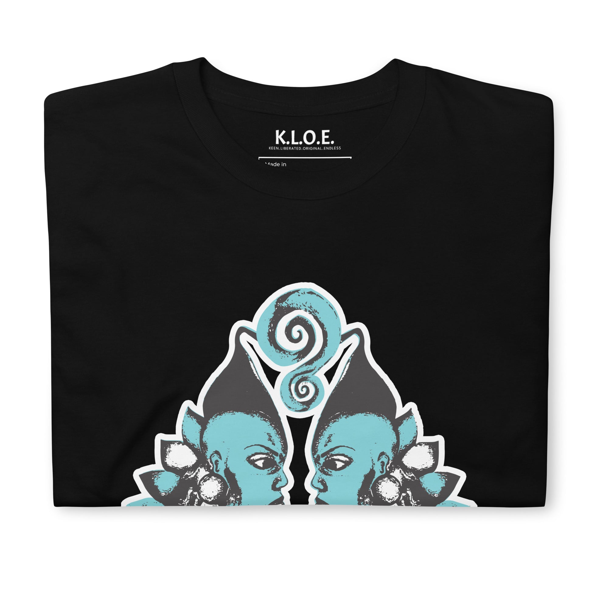 Black K.L.O.E. t-shirt showcasing a hand-drawn design of two mirrored faces in black and teal, embodying culturally inspired, bohemian style fashion focused on individuality and artistic expression, detailed view showing the inside label.
