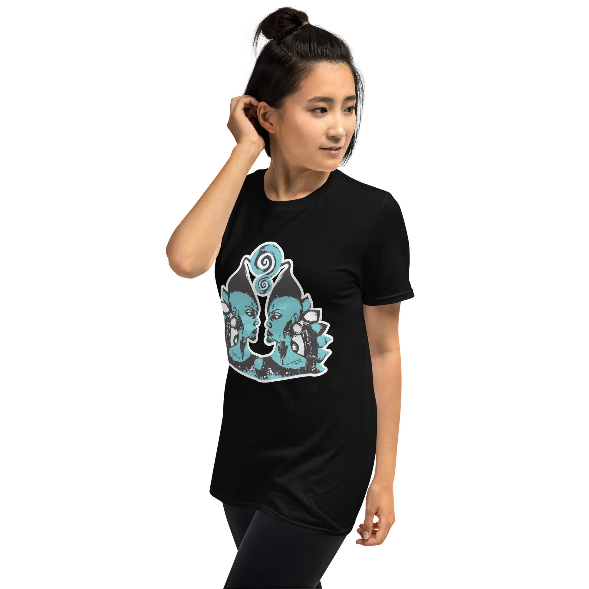 A model wearing black K.L.O.E. t-shirt showcasing a hand-drawn design of two mirrored faces in black and teal, embodying culturally inspired, bohemian style fashion focused on individuality and artistic expression.