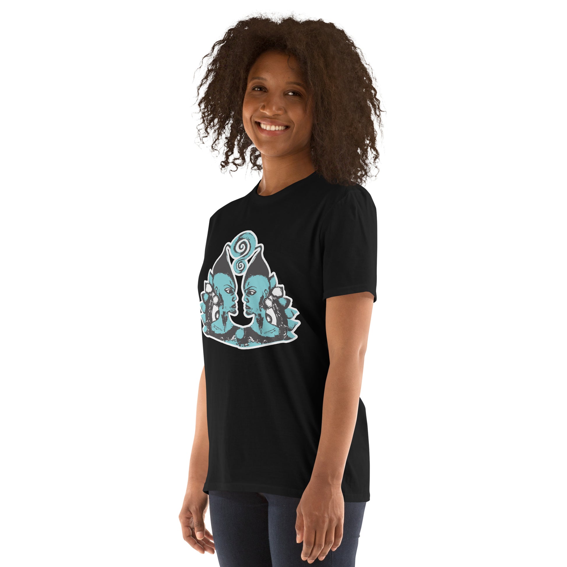 A model wearing black K.L.O.E. t-shirt showcasing a hand-drawn design of two mirrored faces in black and teal, embodying culturally inspired, bohemian style fashion focused on individuality and artistic expression.
