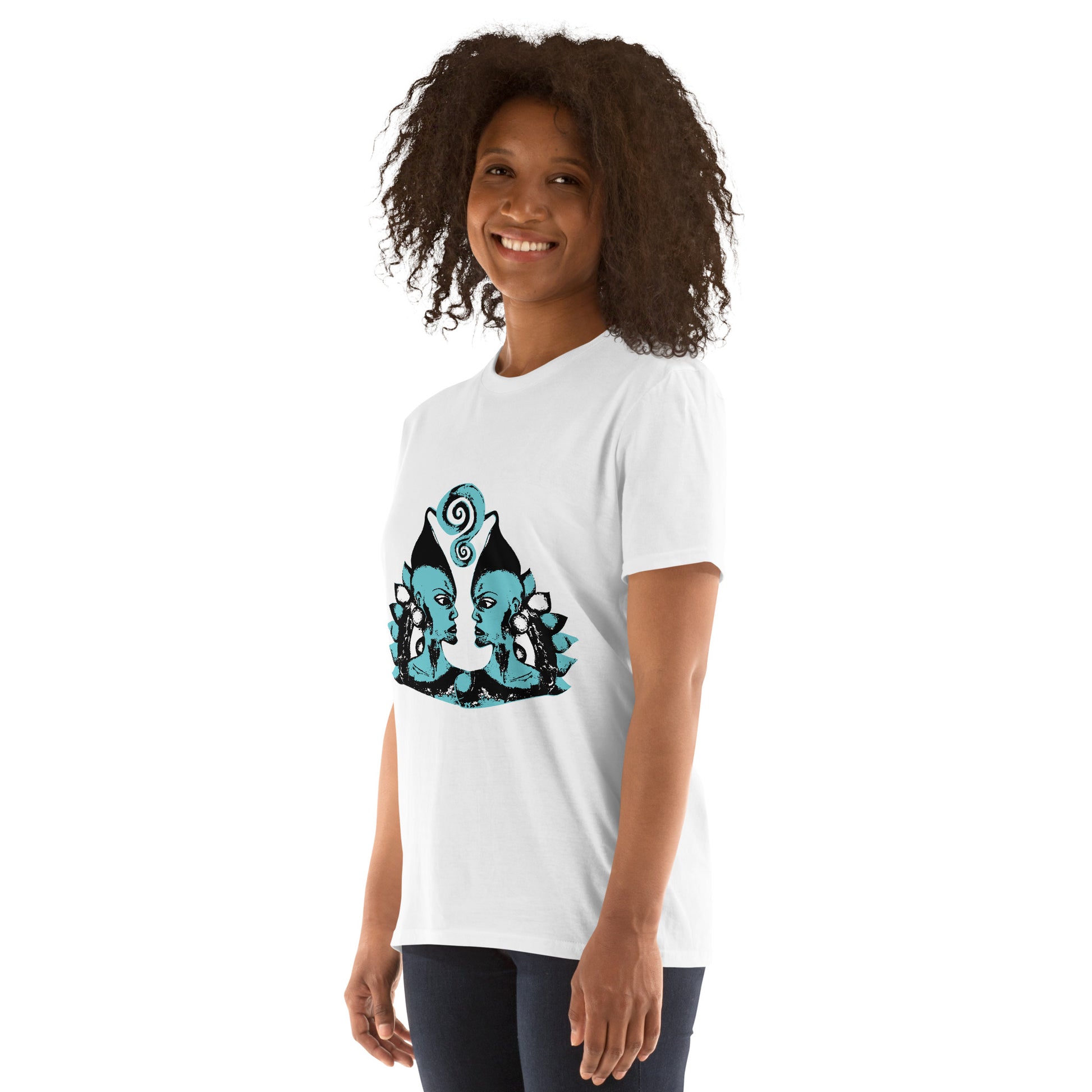 A model wearing white K.L.O.E. t-shirt showcasing a hand-drawn design of two mirrored faces in black and teal, embodying culturally inspired, bohemian style fashion focused on individuality and artistic expression.