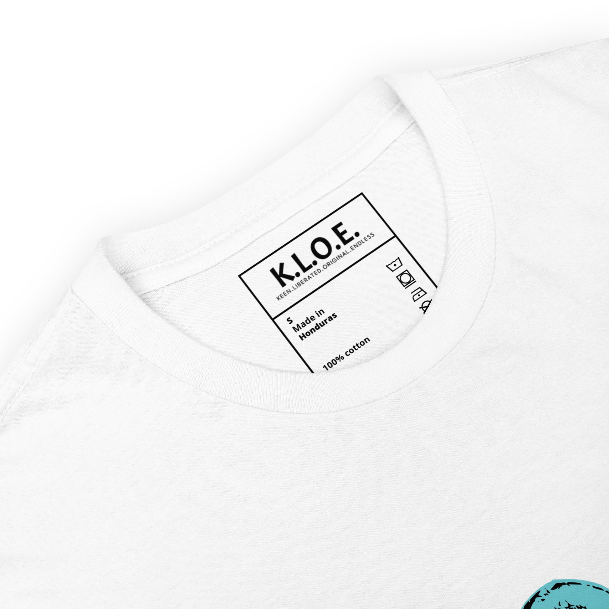 White K.L.O.E. t-shirt showcasing a hand-drawn design of two mirrored faces in black and teal, embodying culturally inspired, bohemian style fashion focused on individuality and artistic expression, detailed view showing the inside label.
