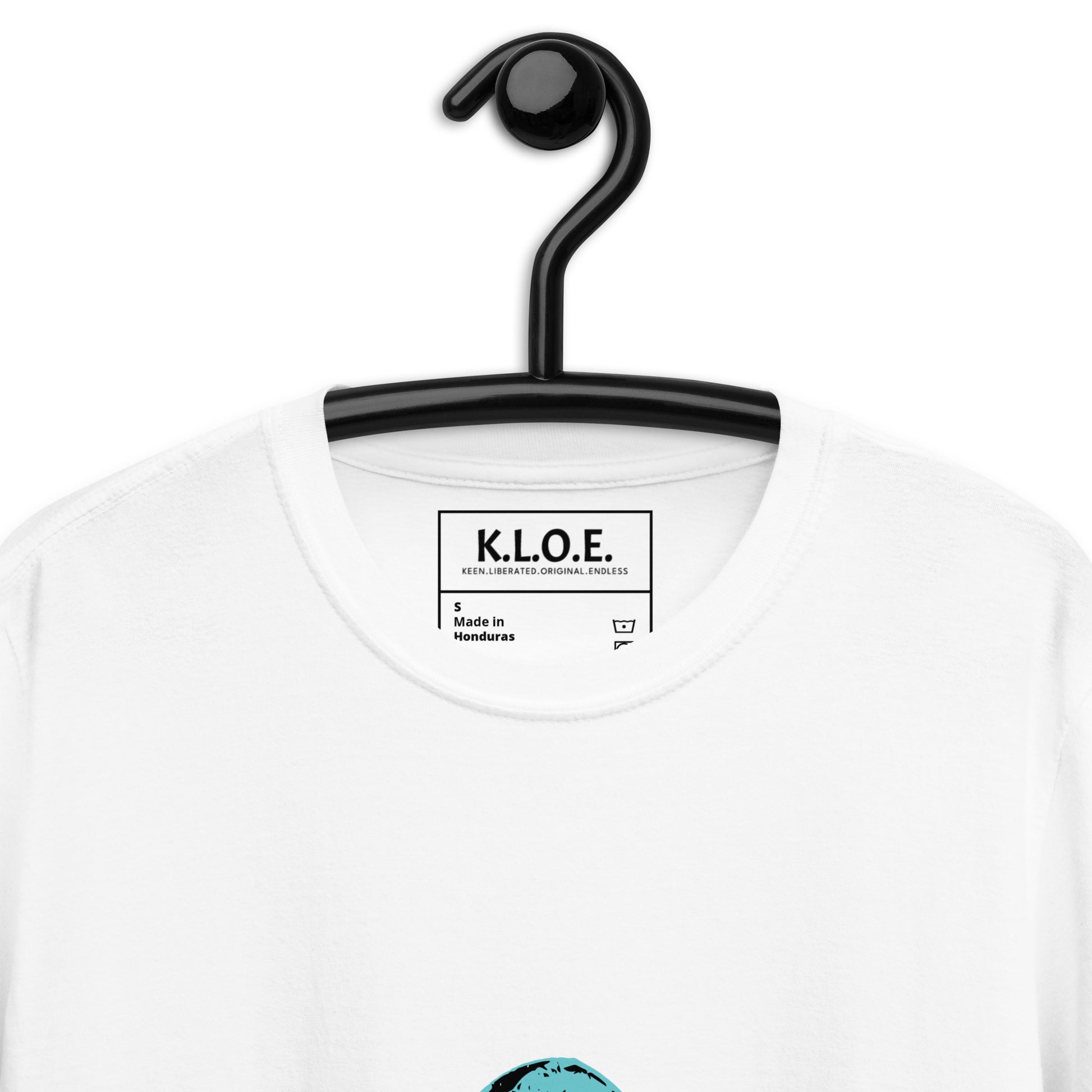 White K.L.O.E. t-shirt, on a hanger, showcasing a hand-drawn design of two mirrored faces in black and teal, embodying culturally inspired, bohemian style fashion focused on individuality and artistic expression.