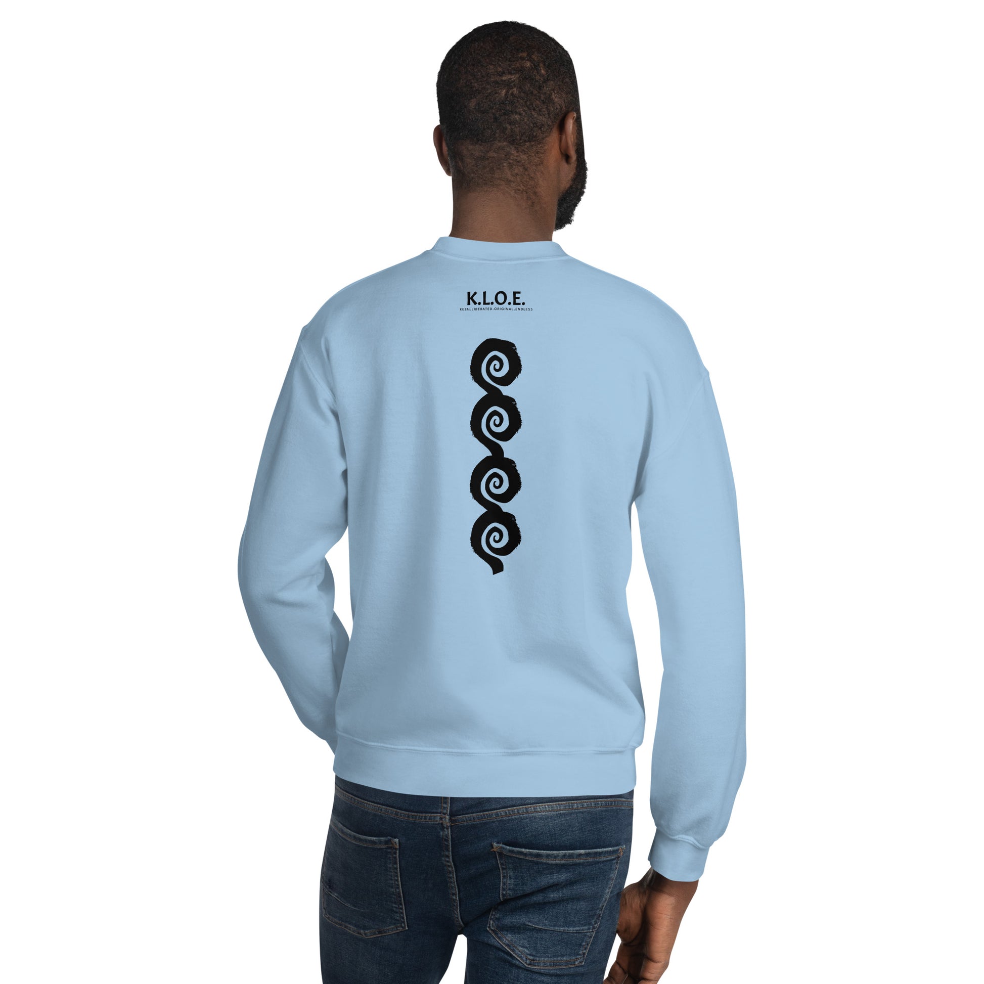 Back view of blue K.L.O.E. sweatshirt showcasing a bold, hand-drawn black spiral design symbolising creativity and individuality, with the K.L.O.E. logo above, reflecting modern bohemian style and artistic self-expression, worn by a male model.