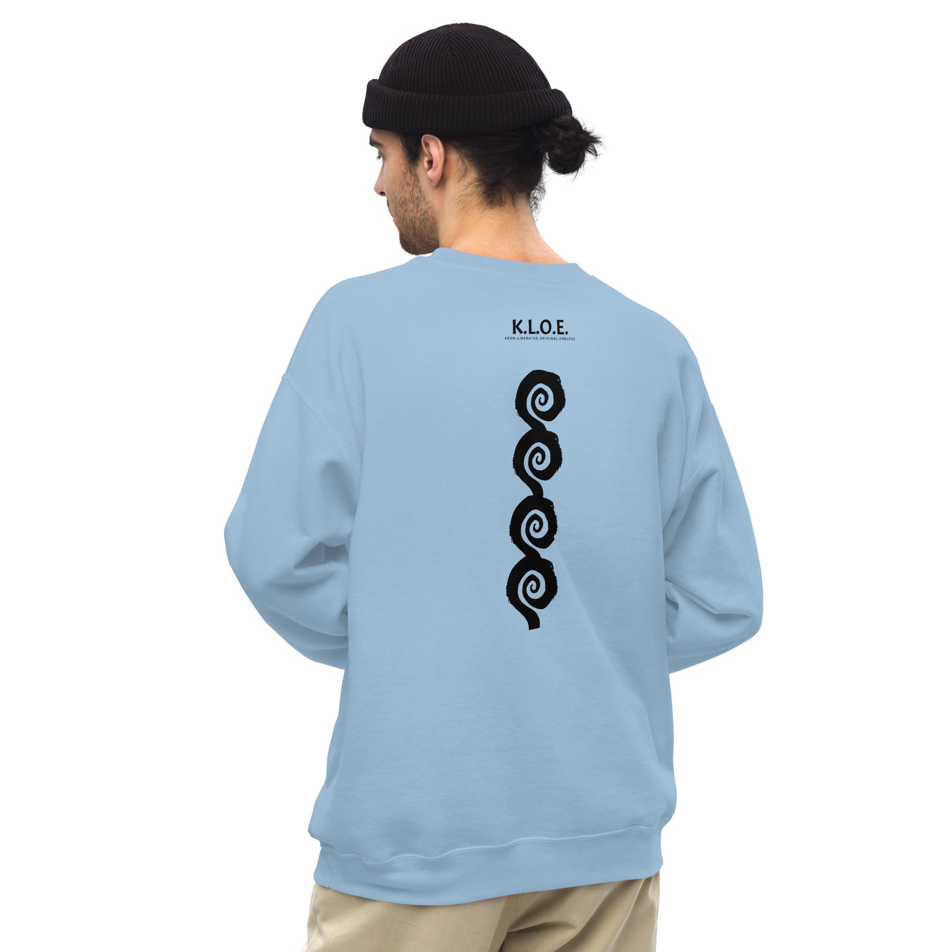 Back view of blue K.L.O.E. sweatshirt showcasing a bold, hand-drawn black spiral design symbolising creativity and individuality, with the K.L.O.E. logo above, reflecting modern bohemian style and artistic self-expression, worn by a male model.